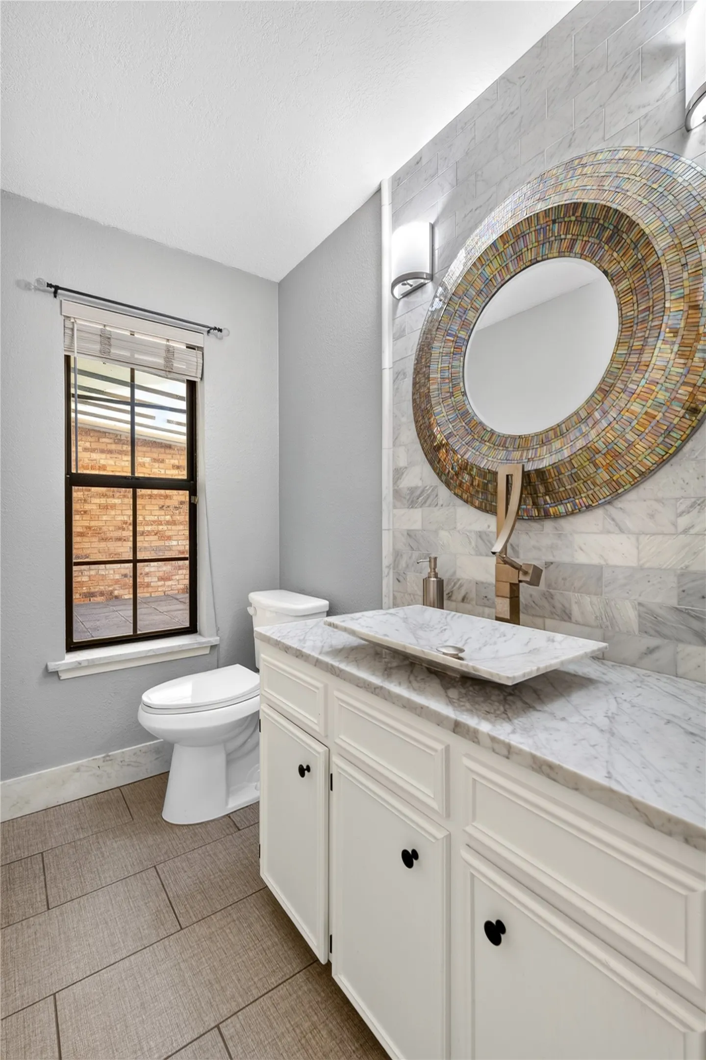Beautiful downstairs half bath.