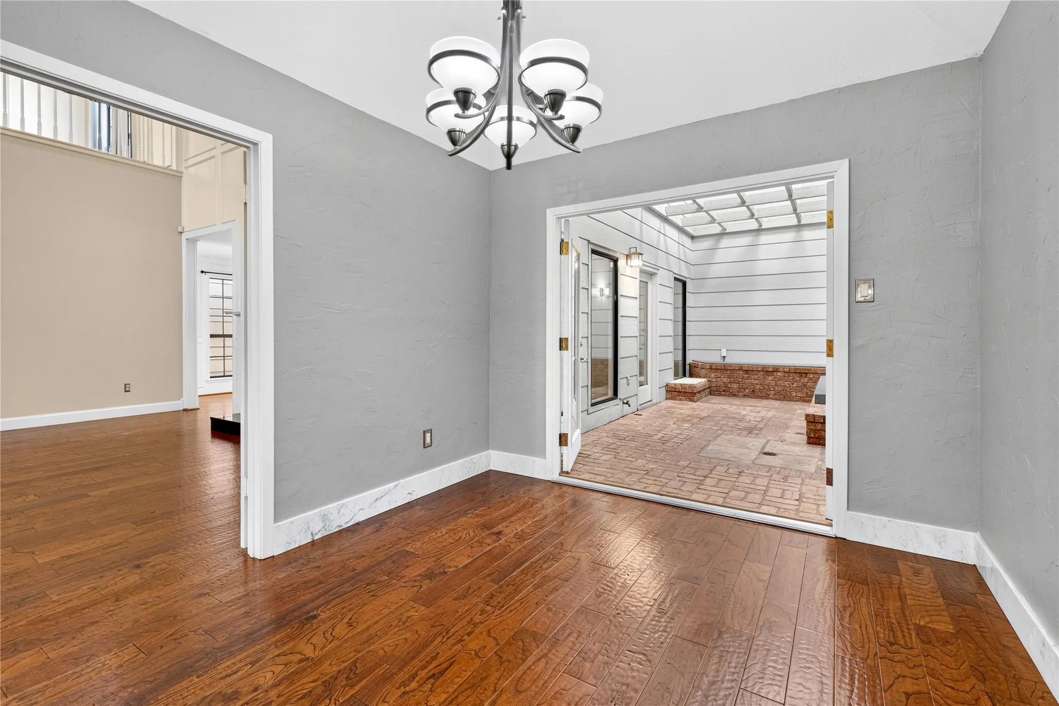 Open the double doors for an extended space into the atrium.