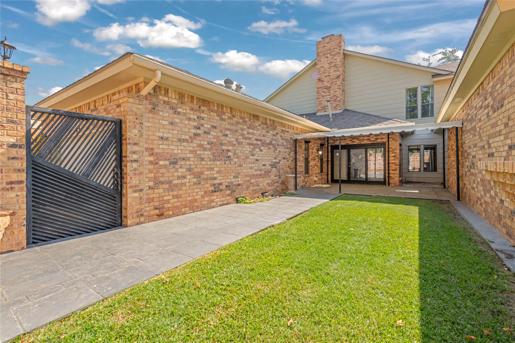 Low maintenance back yard. Side gate to rear entry garage.