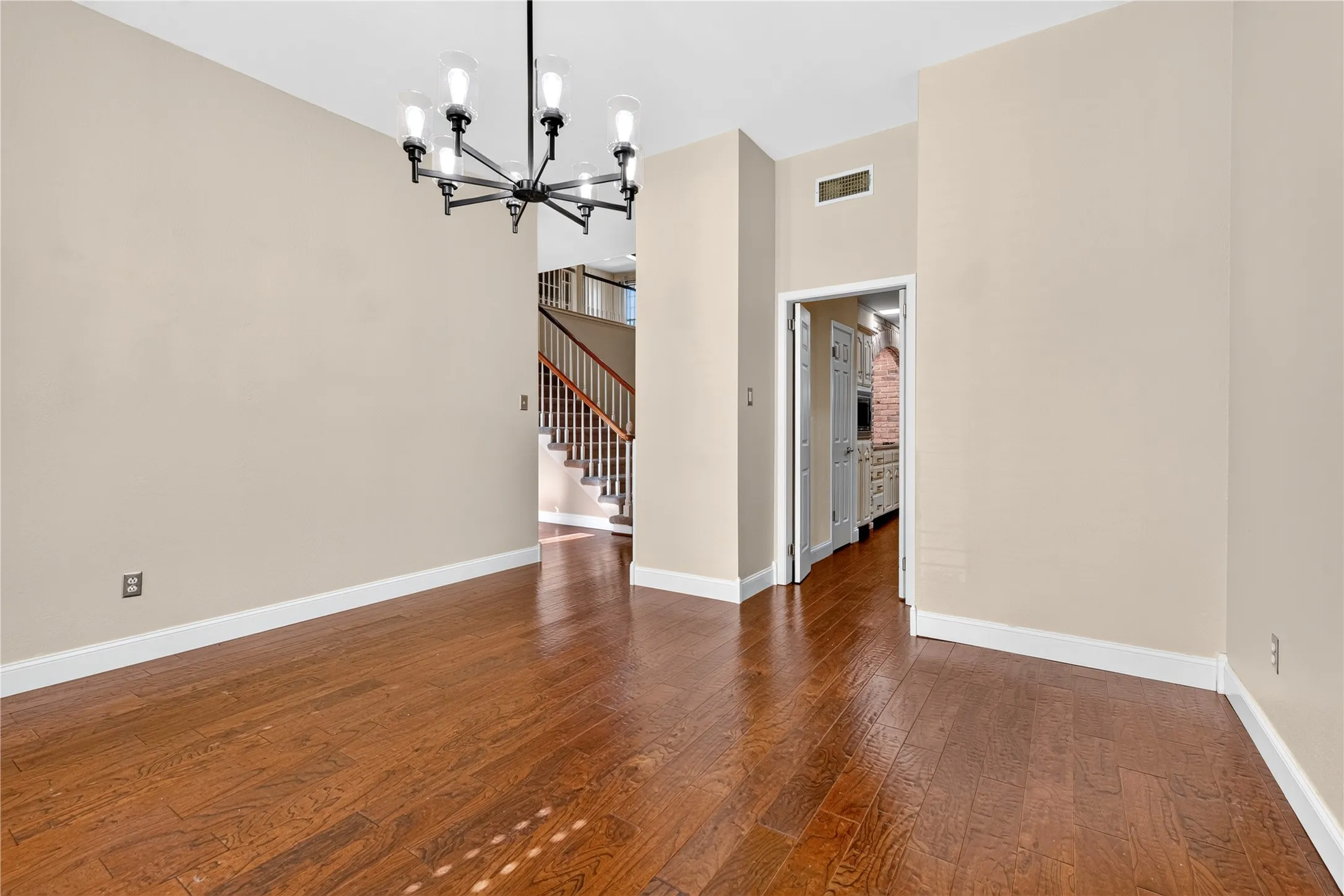 Double doors lead to the galley kitchen from the formal dining.