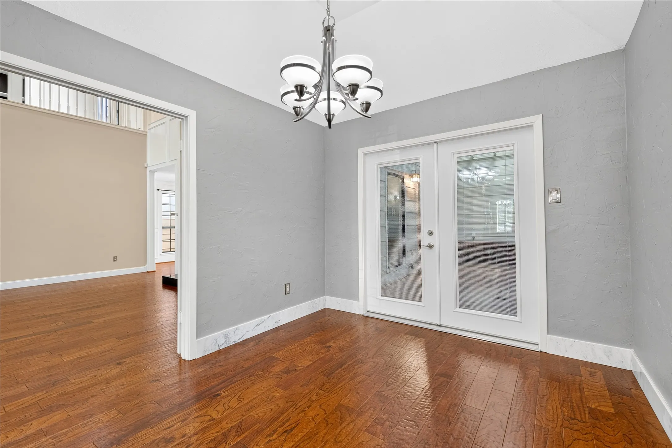 Double doors overlook the closed in atrium from the breakfast nook.