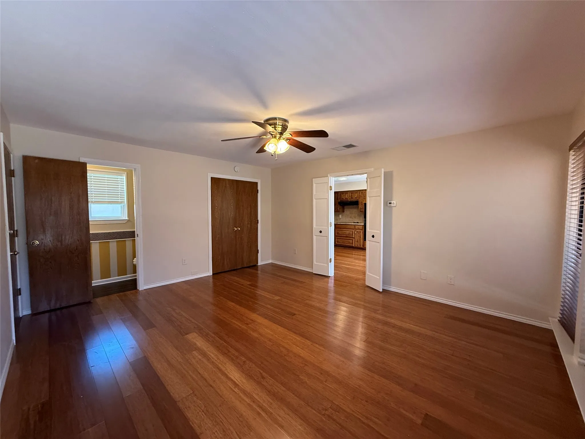 Second living area off of kitchen with half bath and access to garage