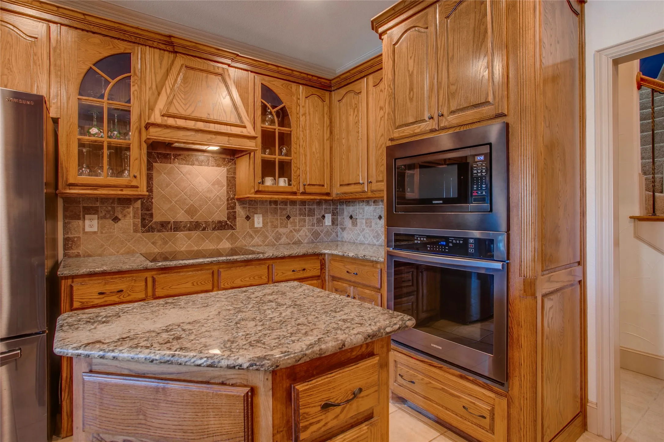 Kitchen features updated appliances including an induction cook top