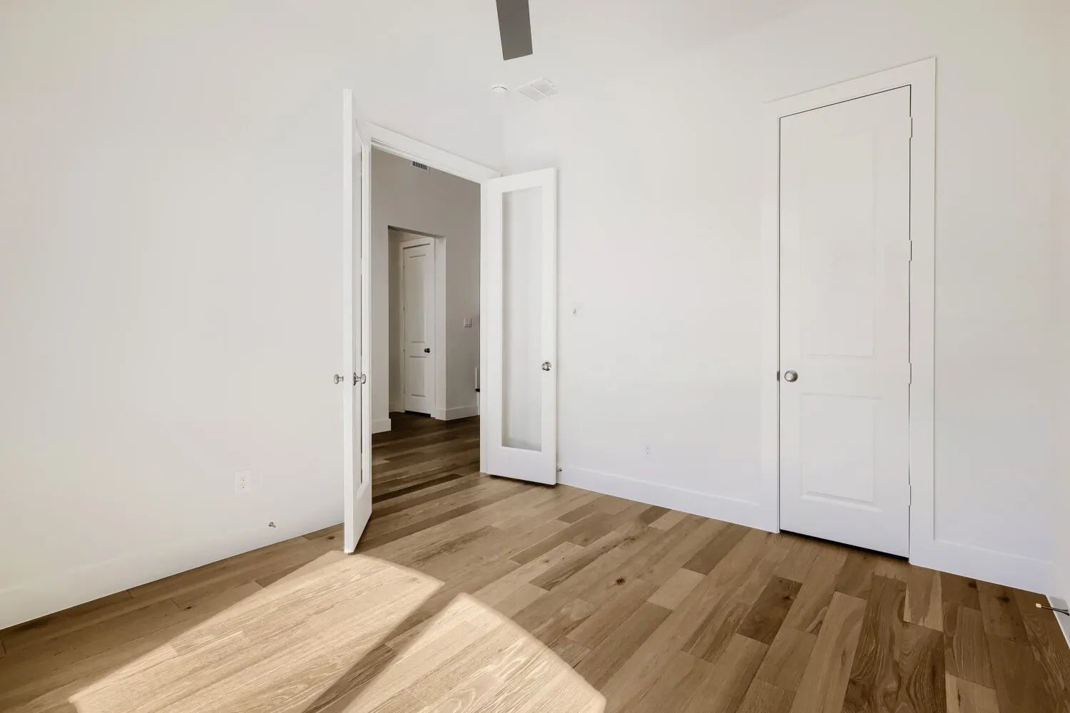 Wood-finish flooring with white walls