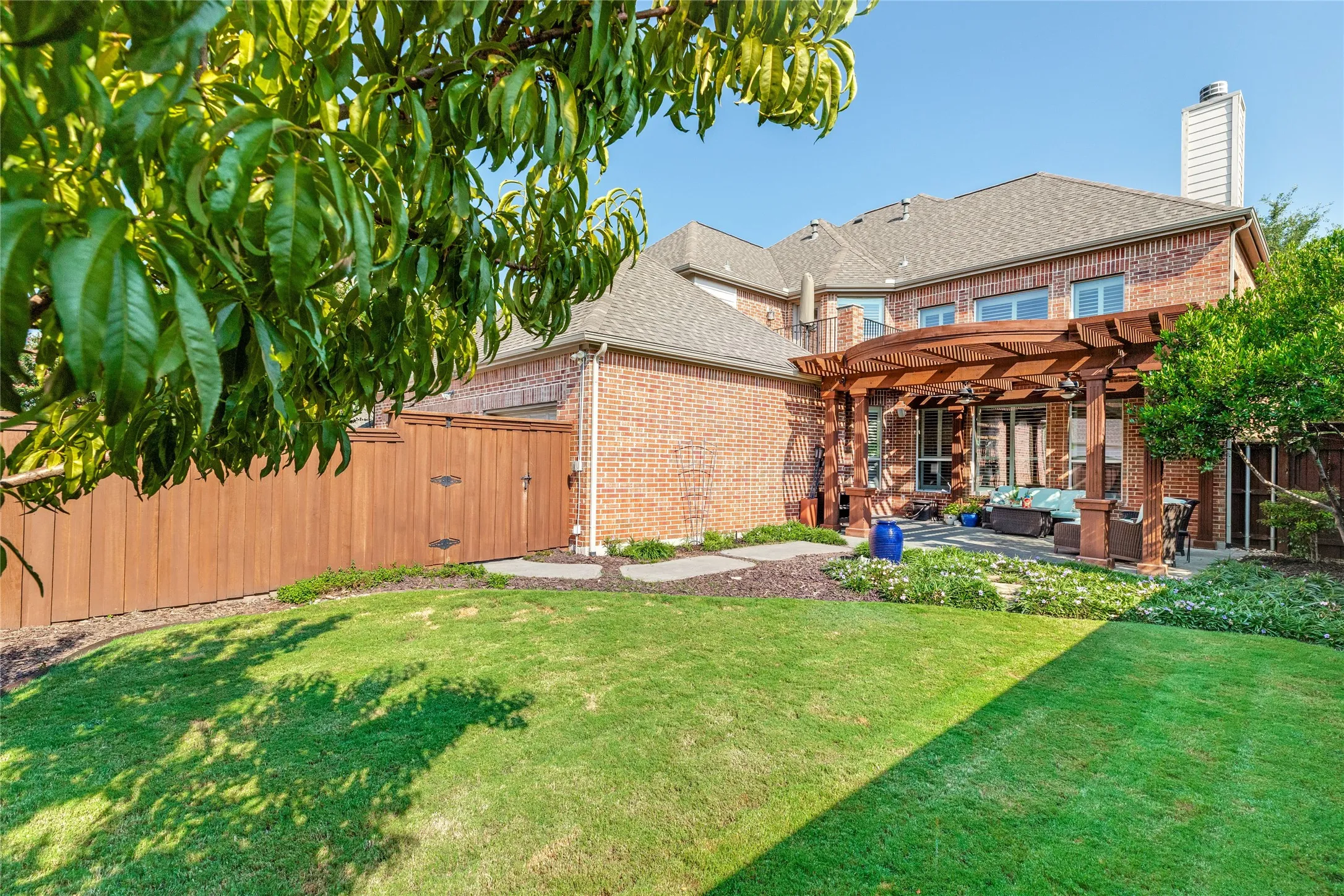 Spacious backyard with view of Pergola over patio