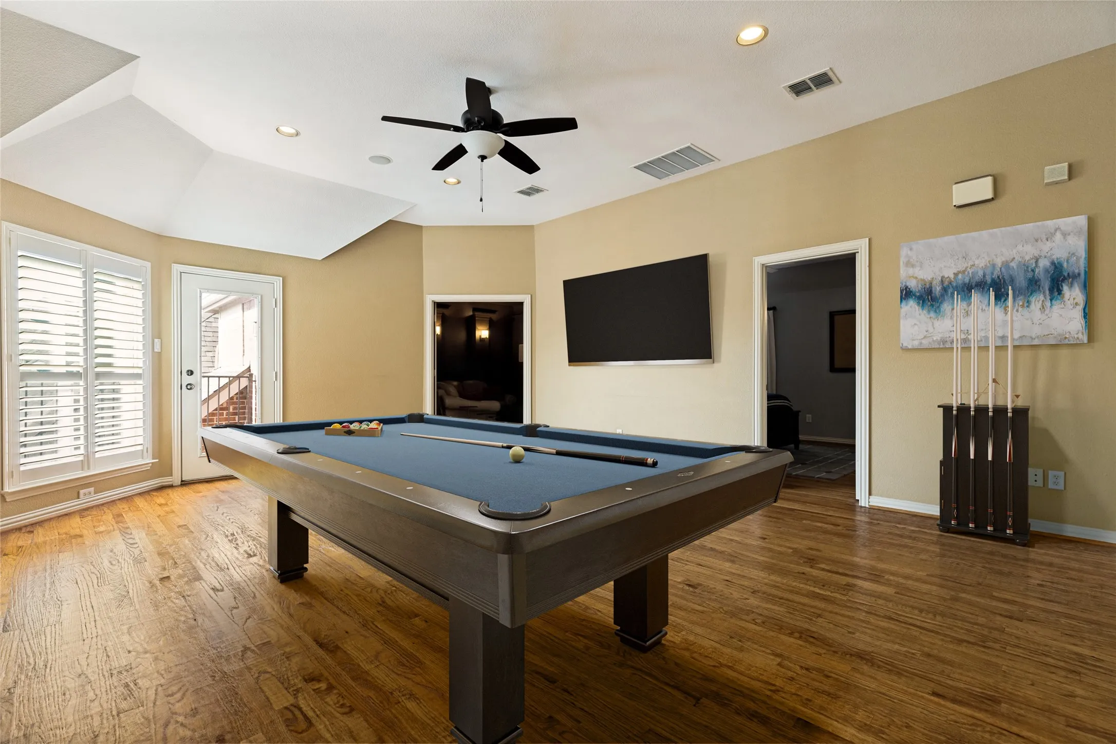 Virtually Staged! HUGE Gameroom Up w Hardwood flooring and door to balcony!