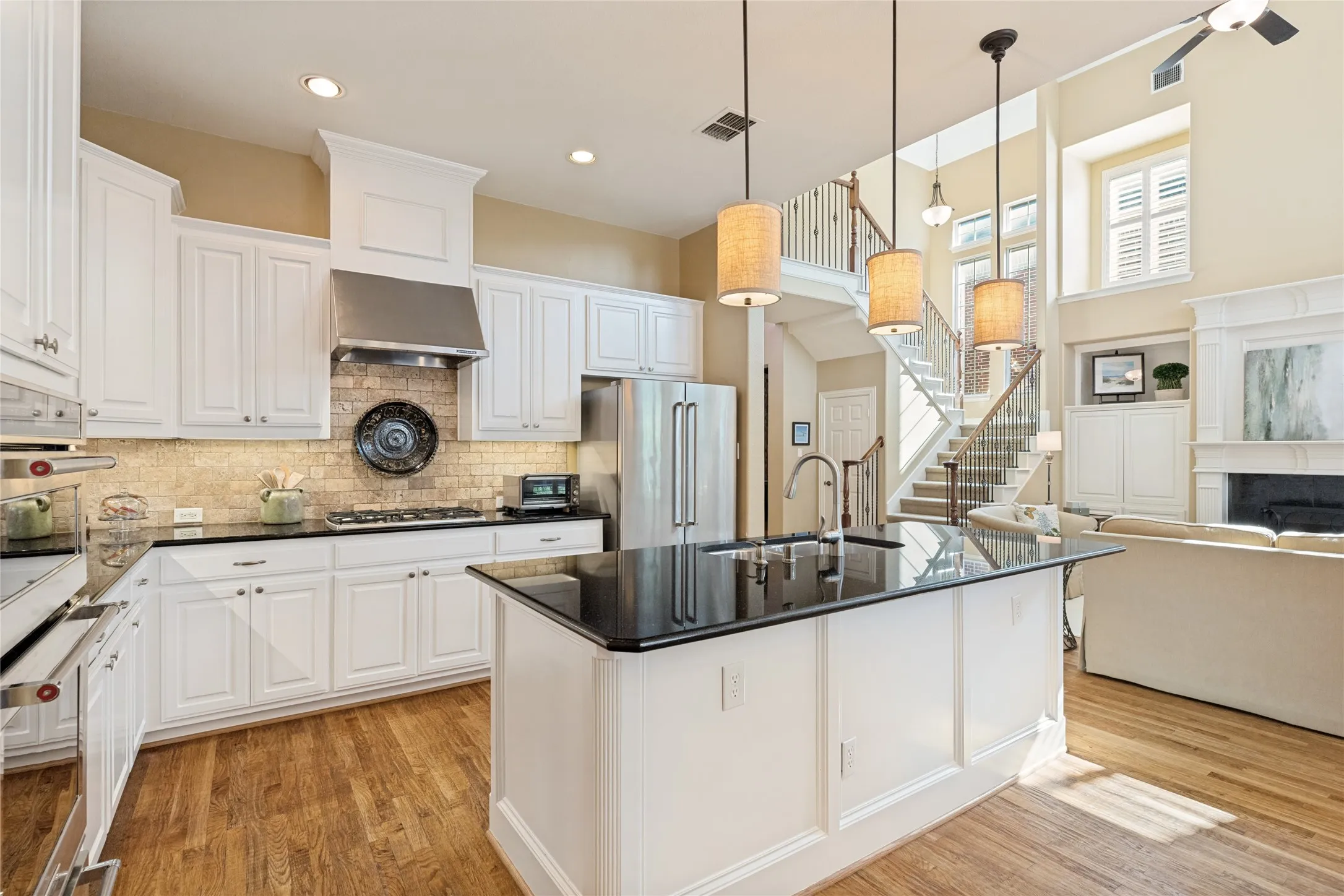 Kitchen with Isand, Breakfast Bar, SS Appliances, Granite Counters, Gas Cooktop and Walk-in Pantry