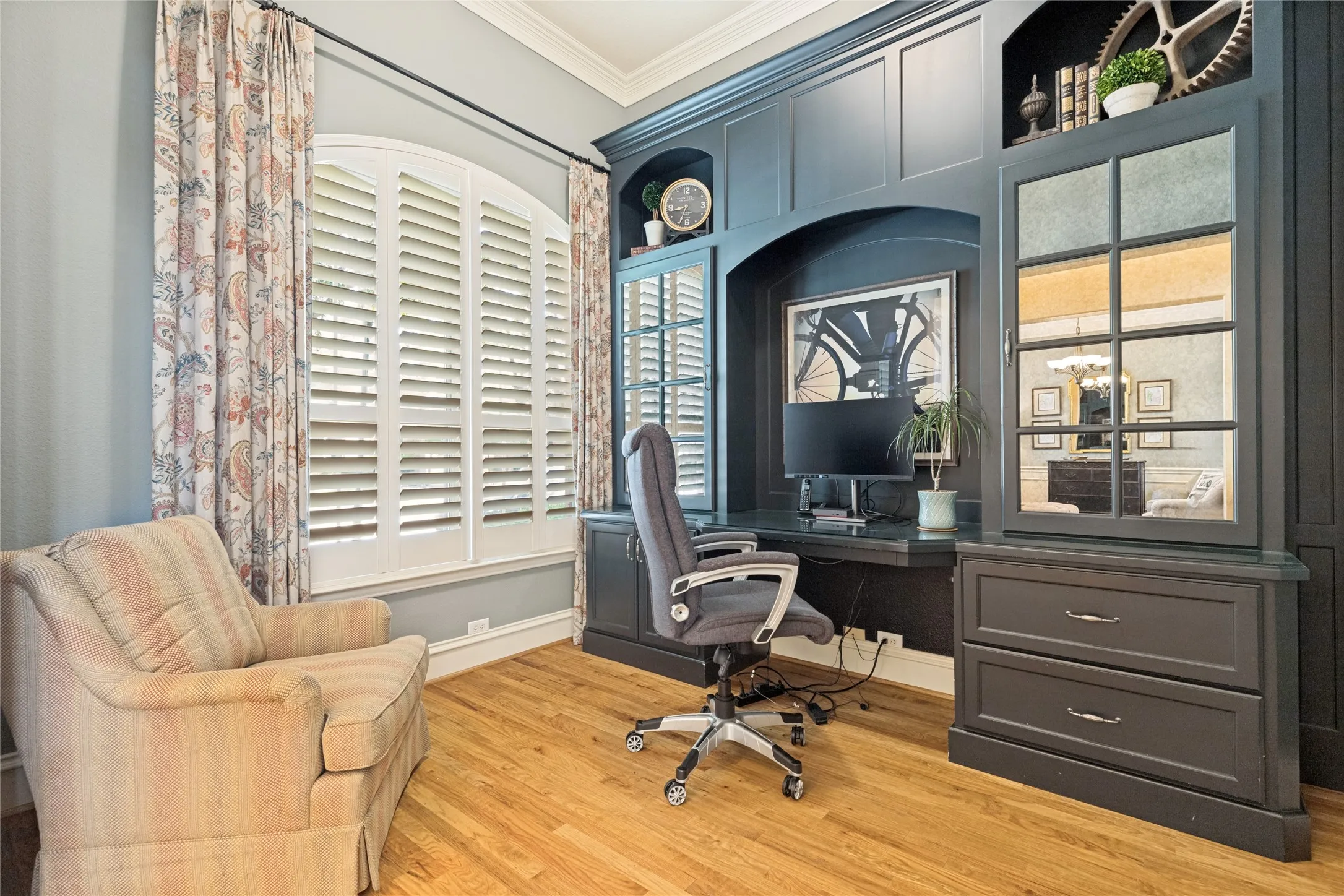 Beautiful study downstairs with gorgeous custom builtin desk w cabinets and bookshelves, drawers