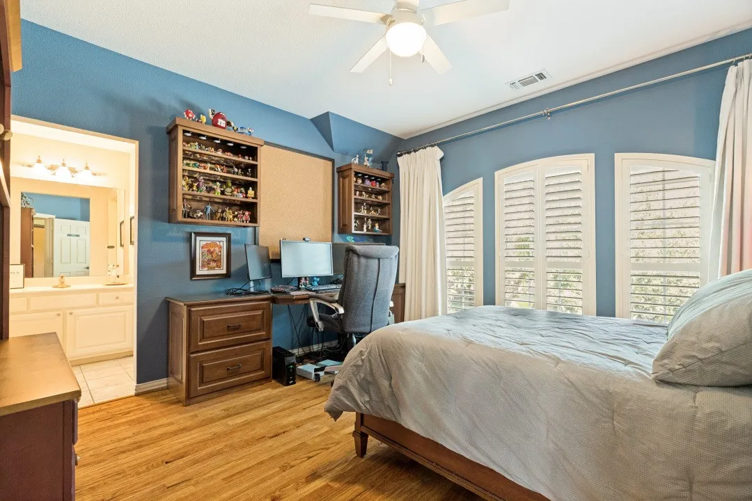 Bedroom #4 located on second level -Hardwood floors, Plantation Shutters, WIC, Ceiling Fan