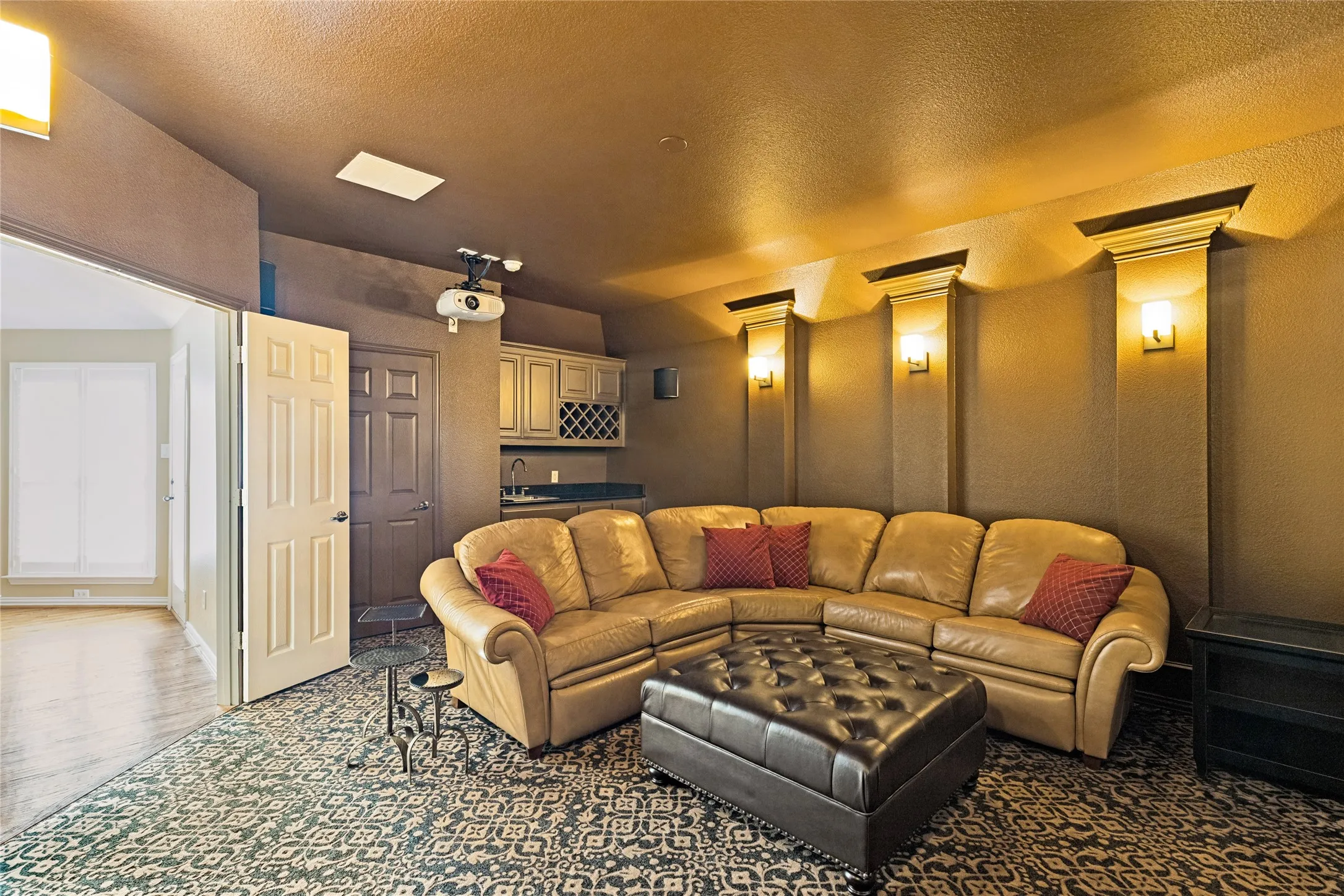 View of Media Room and Wet Bar- Media Room is the only carpeted Living Area in the home