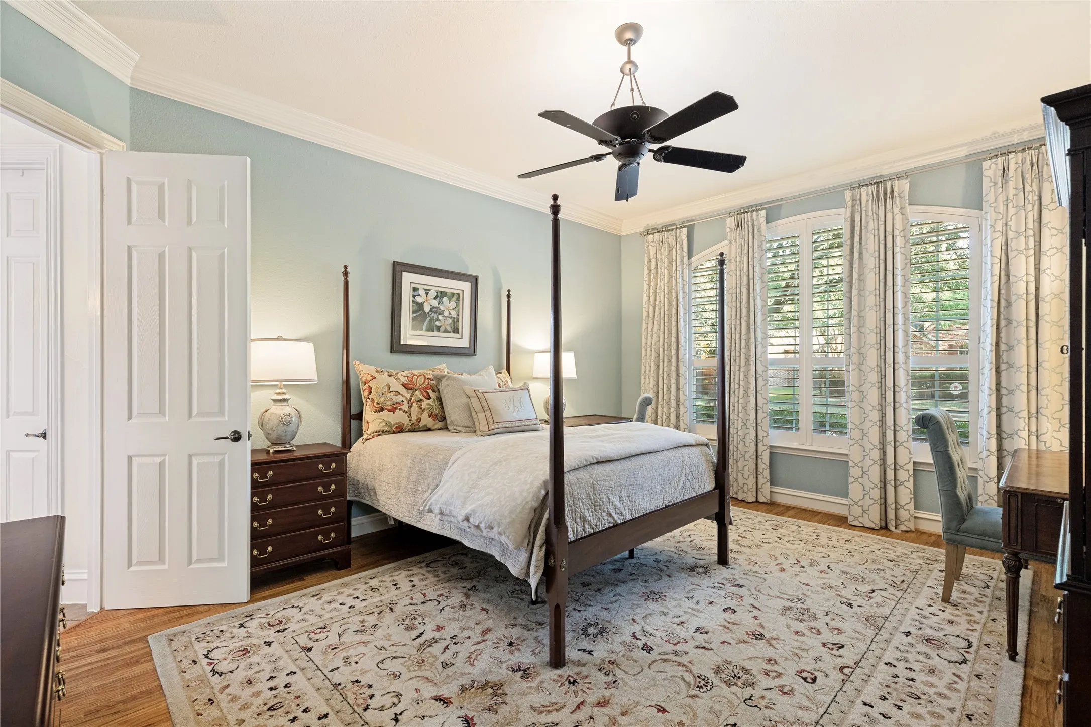 Primary Bedroom complete with Plantation Shutters, Ceiling Fan and Ensuite Bath