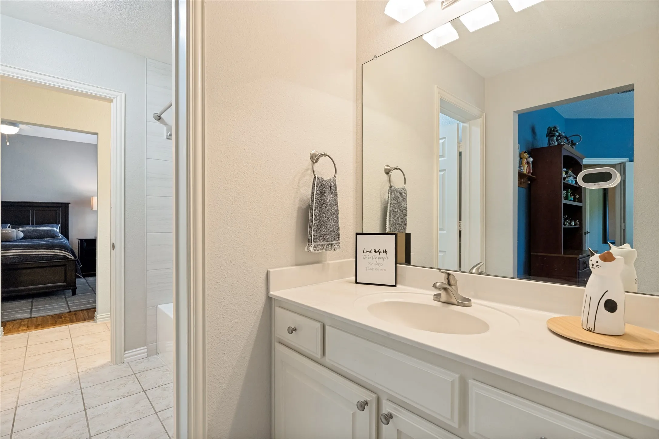 Triple access bathroom Upstairs with sinks in three separate areas, and shower-tub combo separated as well