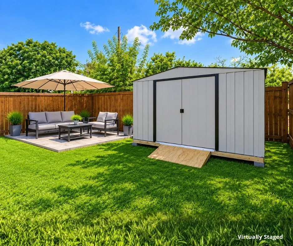 Virtually staged to showcase the outdoor living potential. Concrete patio pad and storage shed are included.