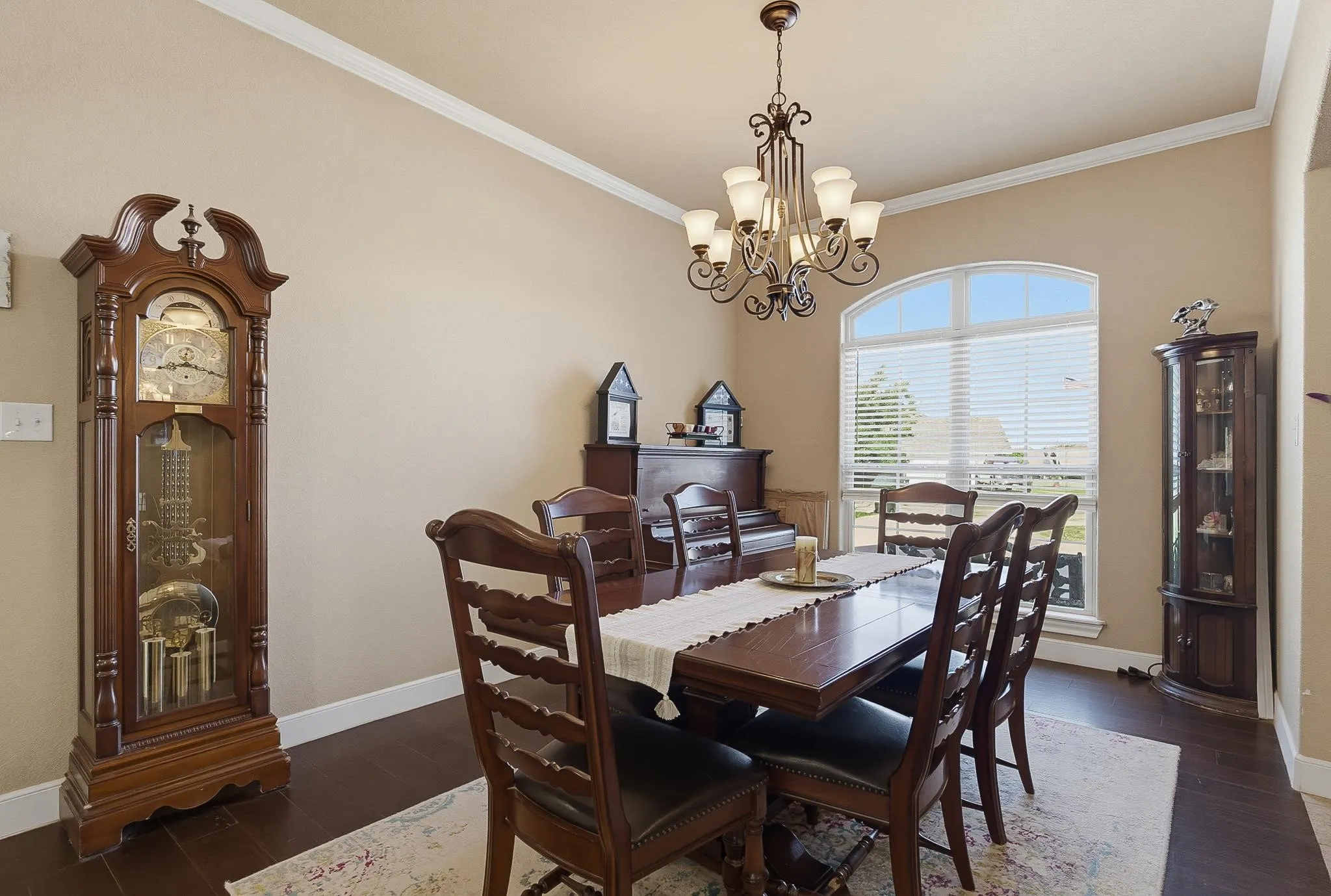 Formal dining area featuring wood-finish flooring and a decorative chandelier
