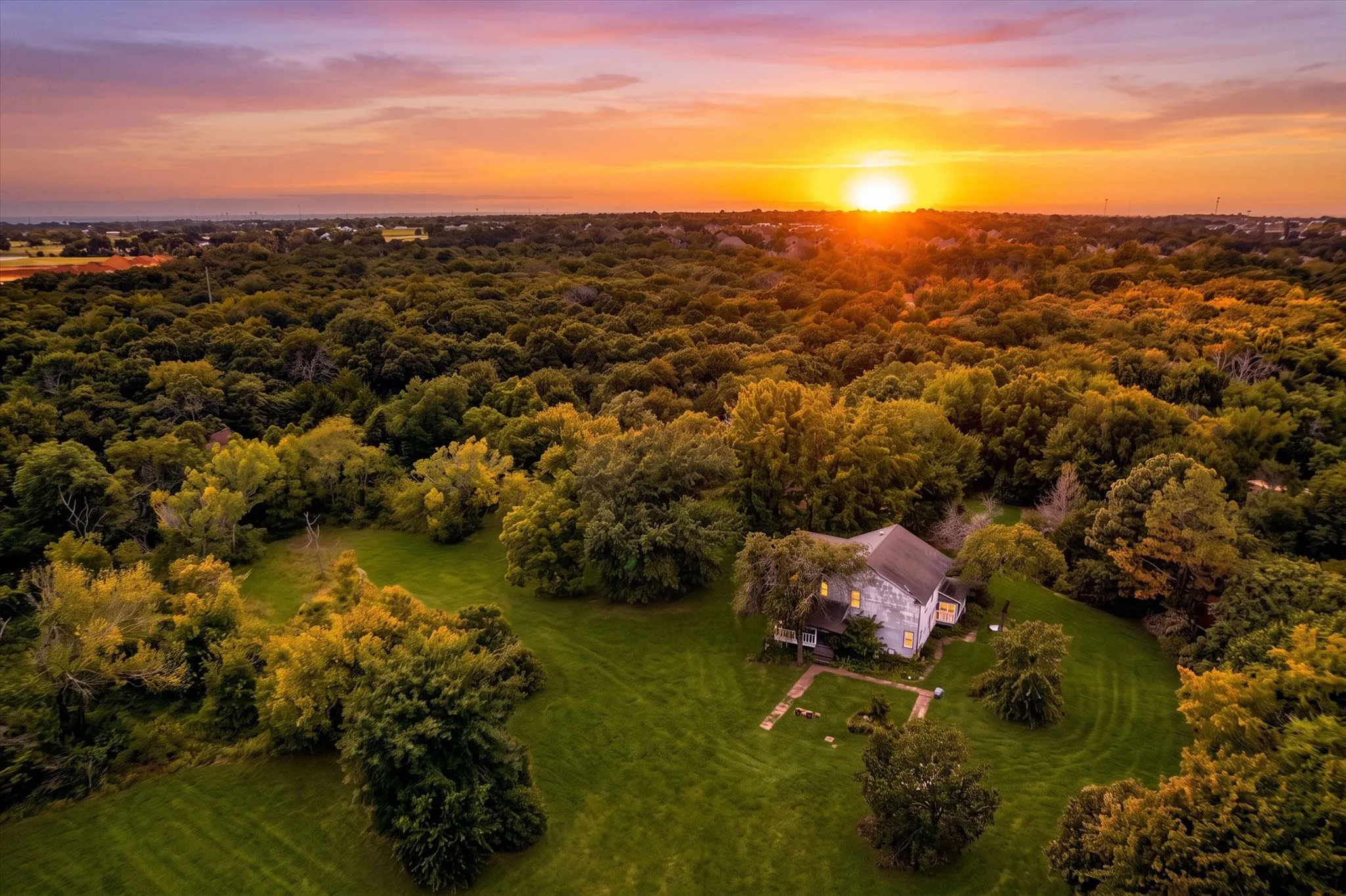 Rural property surrounded by extensive natural tree coverage