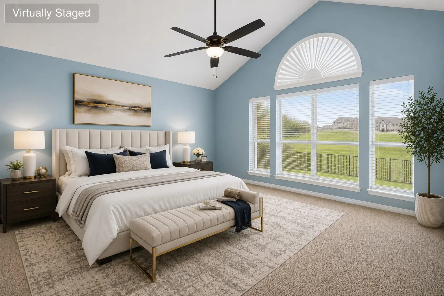 Vaulted ceiling bedroom with a prominent arched window and three rectangular windows offering expansive outdoor scenery
