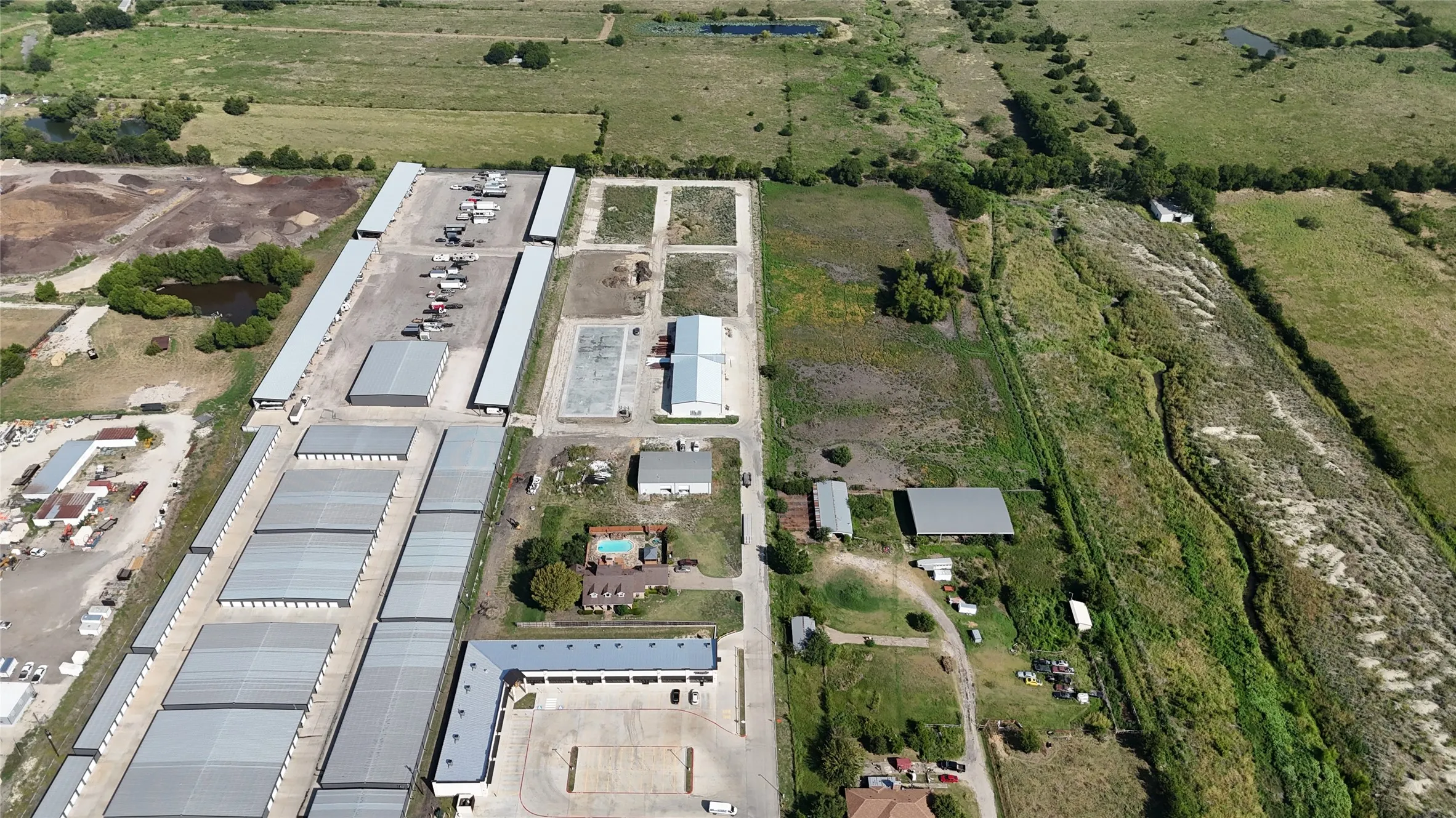 Aerial perspective showcasing multiple industrial buildings with extensive paved areas