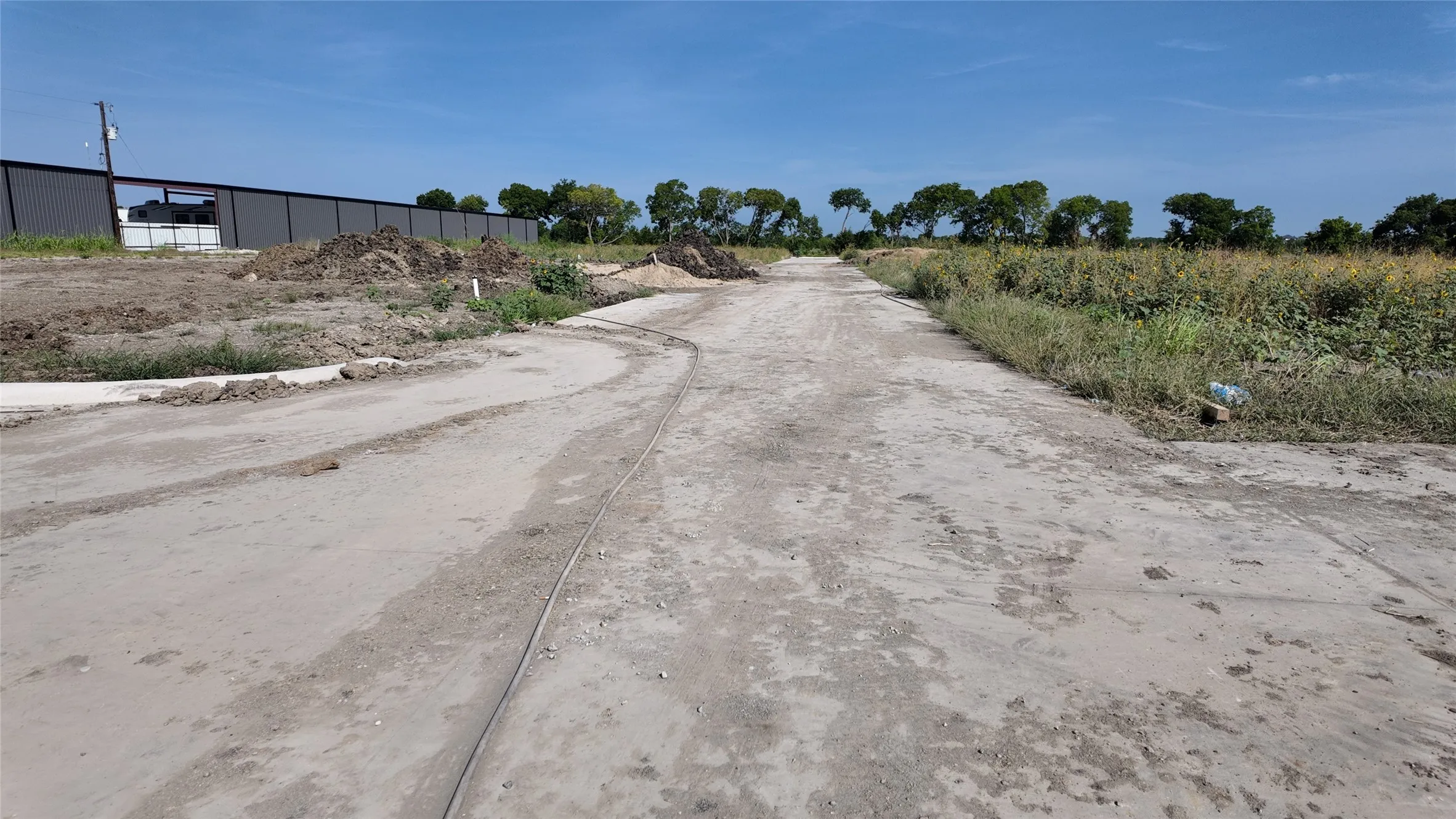 Expansive cleared lot featuring a natural landscape and partially graded terrain
