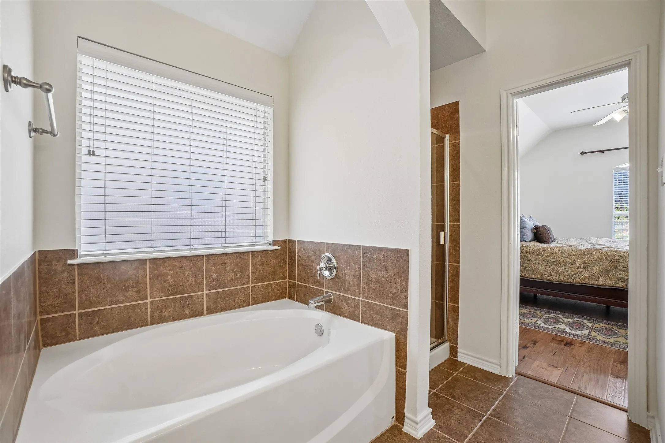 Garden tub and separate shower in the primary bathroom.