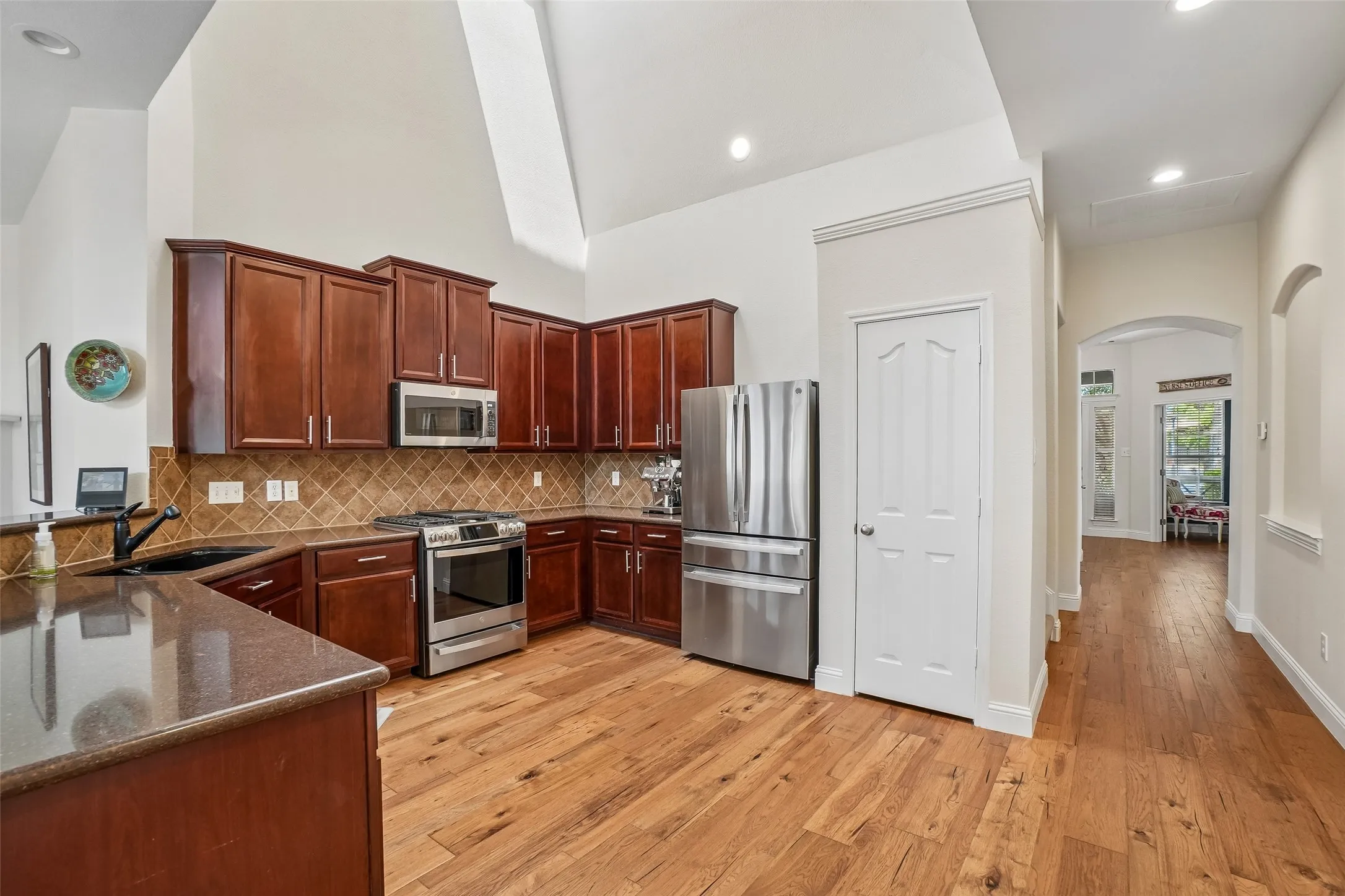 Vaulted ceiling with a skylight provides lots of natural light in the kitchen.