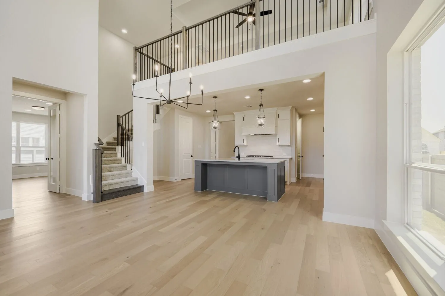 Kitchen with game room overlooking family room
