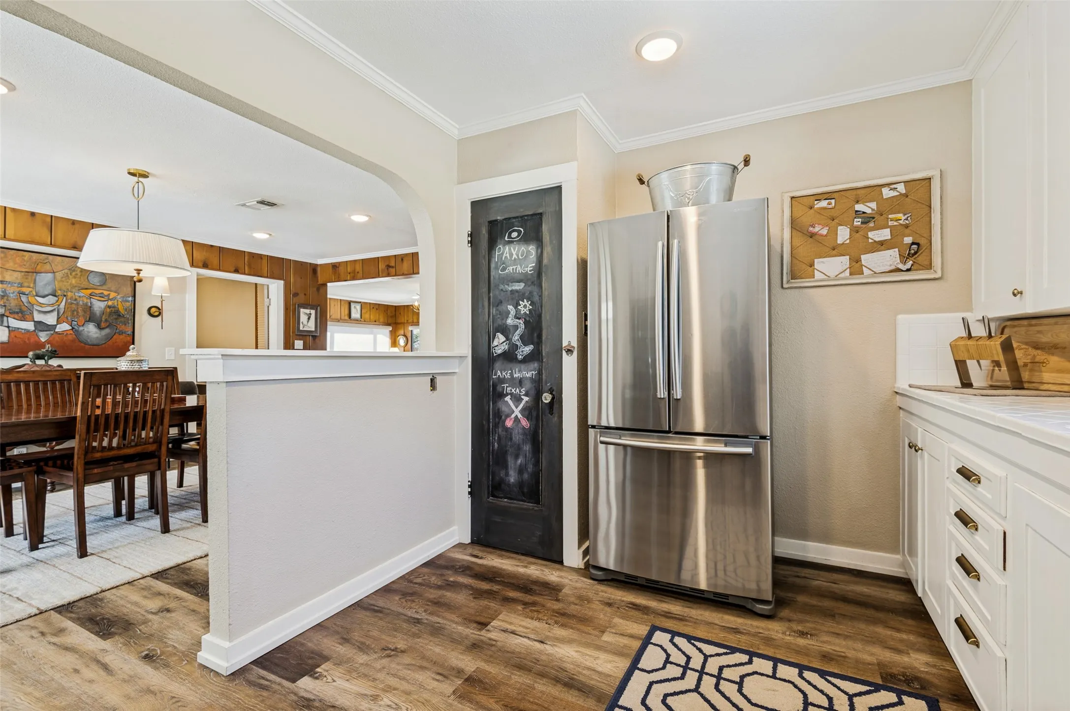 Pantry next to refrigerator.