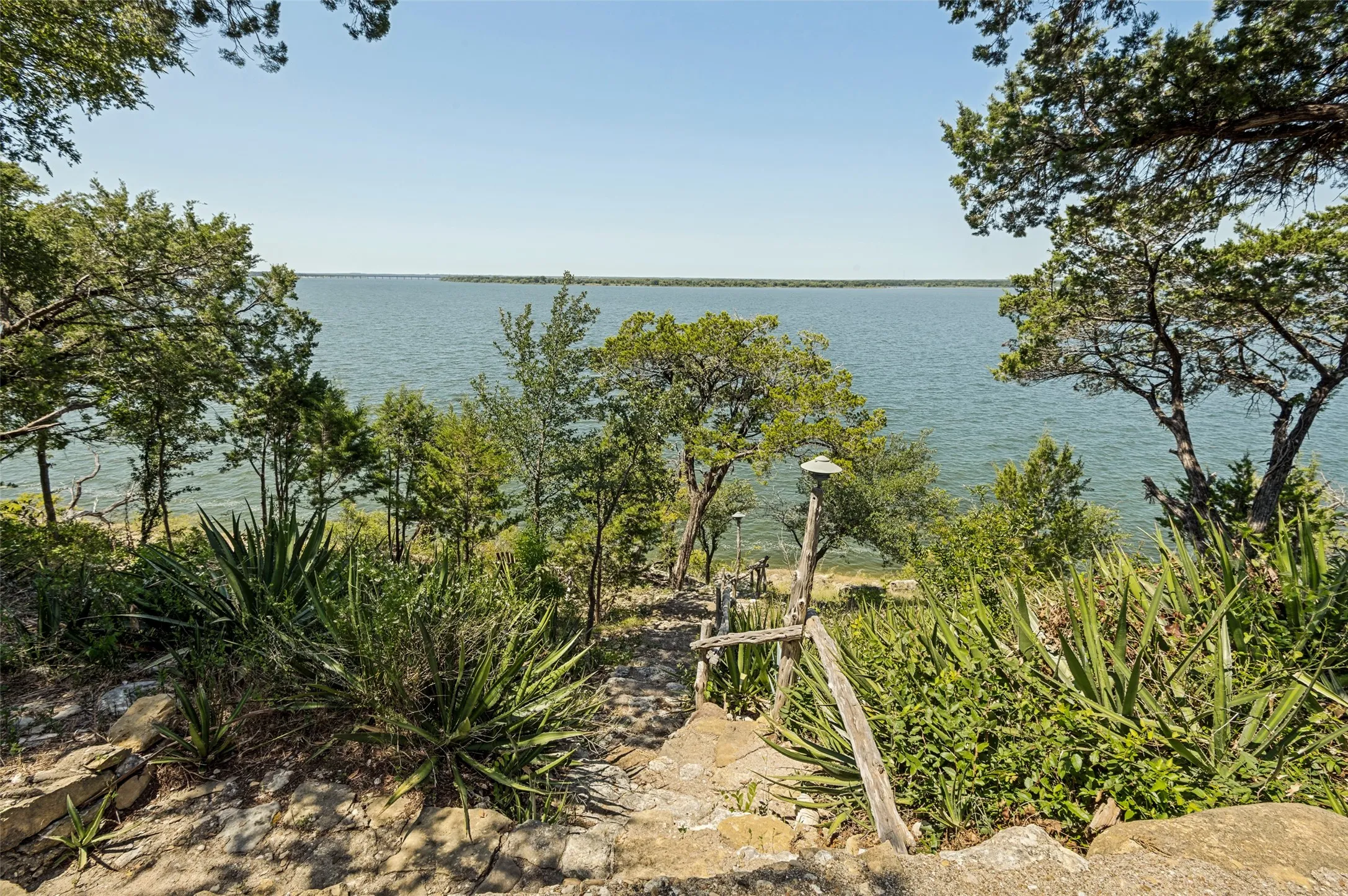 Stone path with lights leads directly down to the lake. Swim, kayak, whatever you fancy.