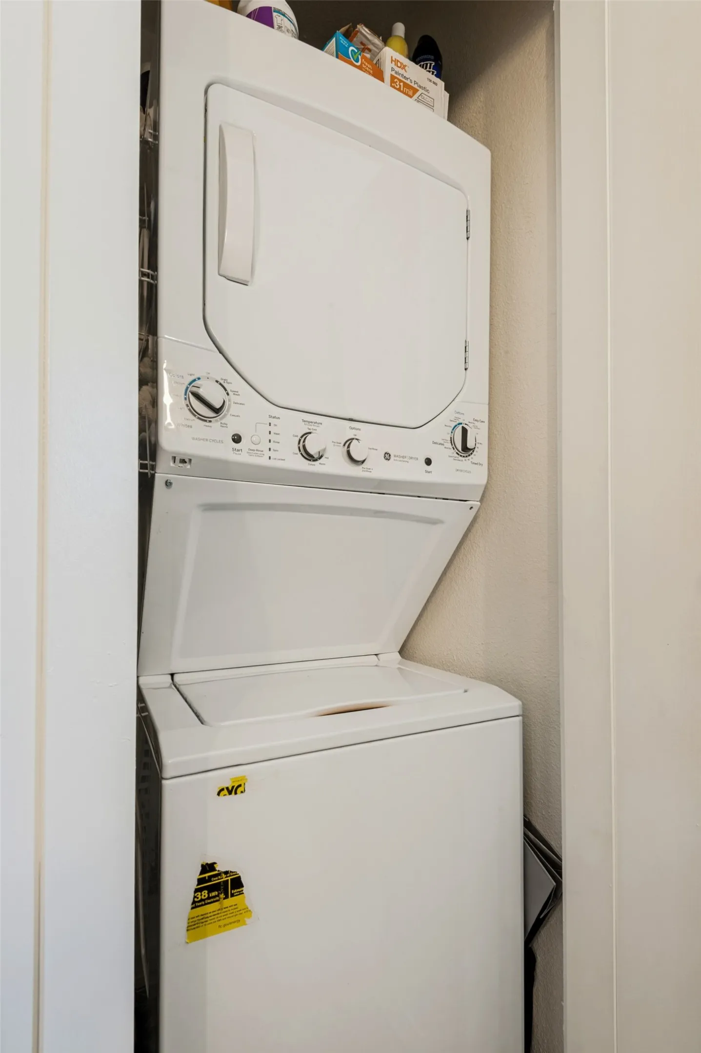 Washer/dryer housed in bathroom closet.