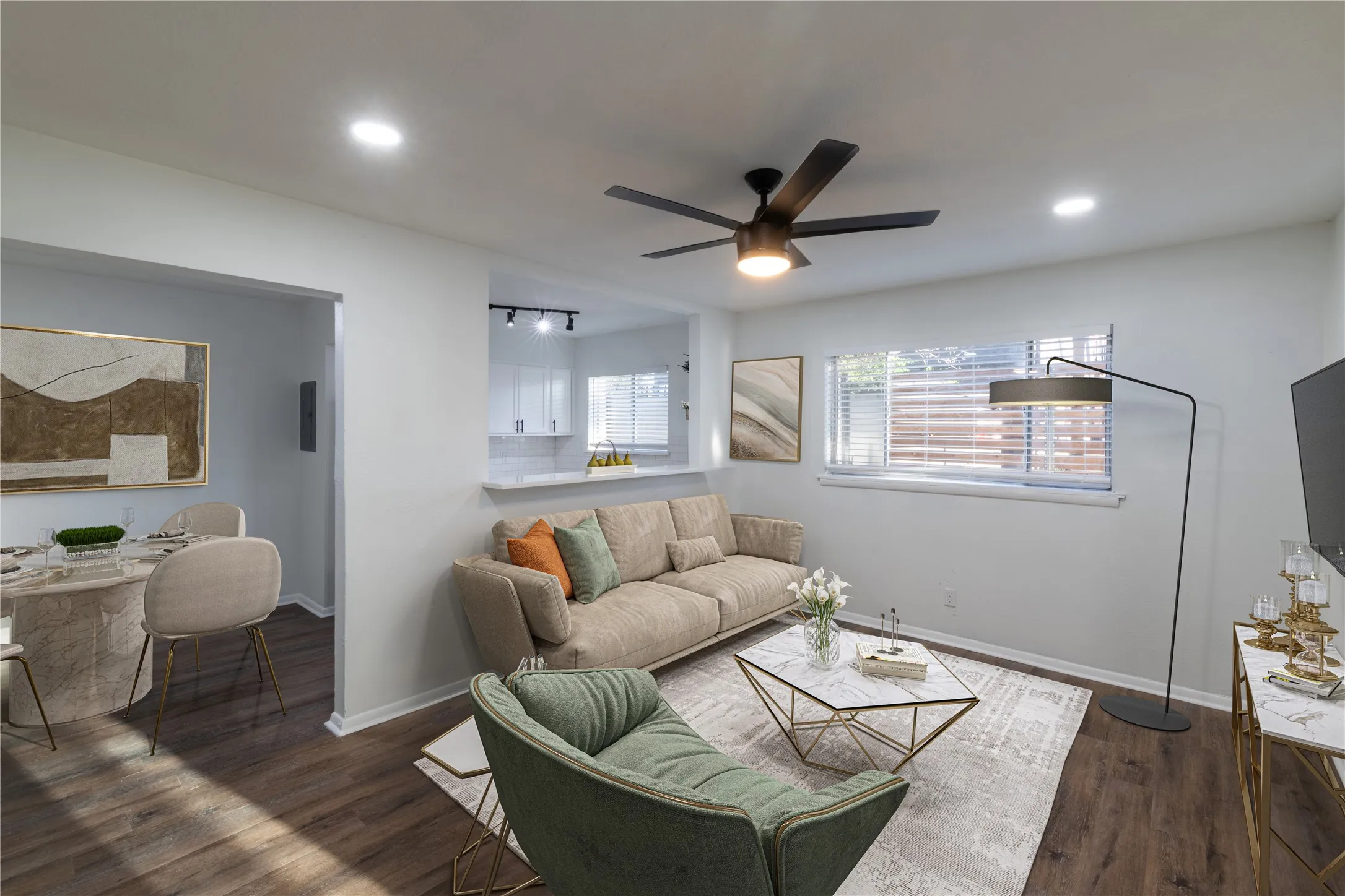 Living area featuring wood-finish flooring, recessed lighting, and a modern ceiling fan