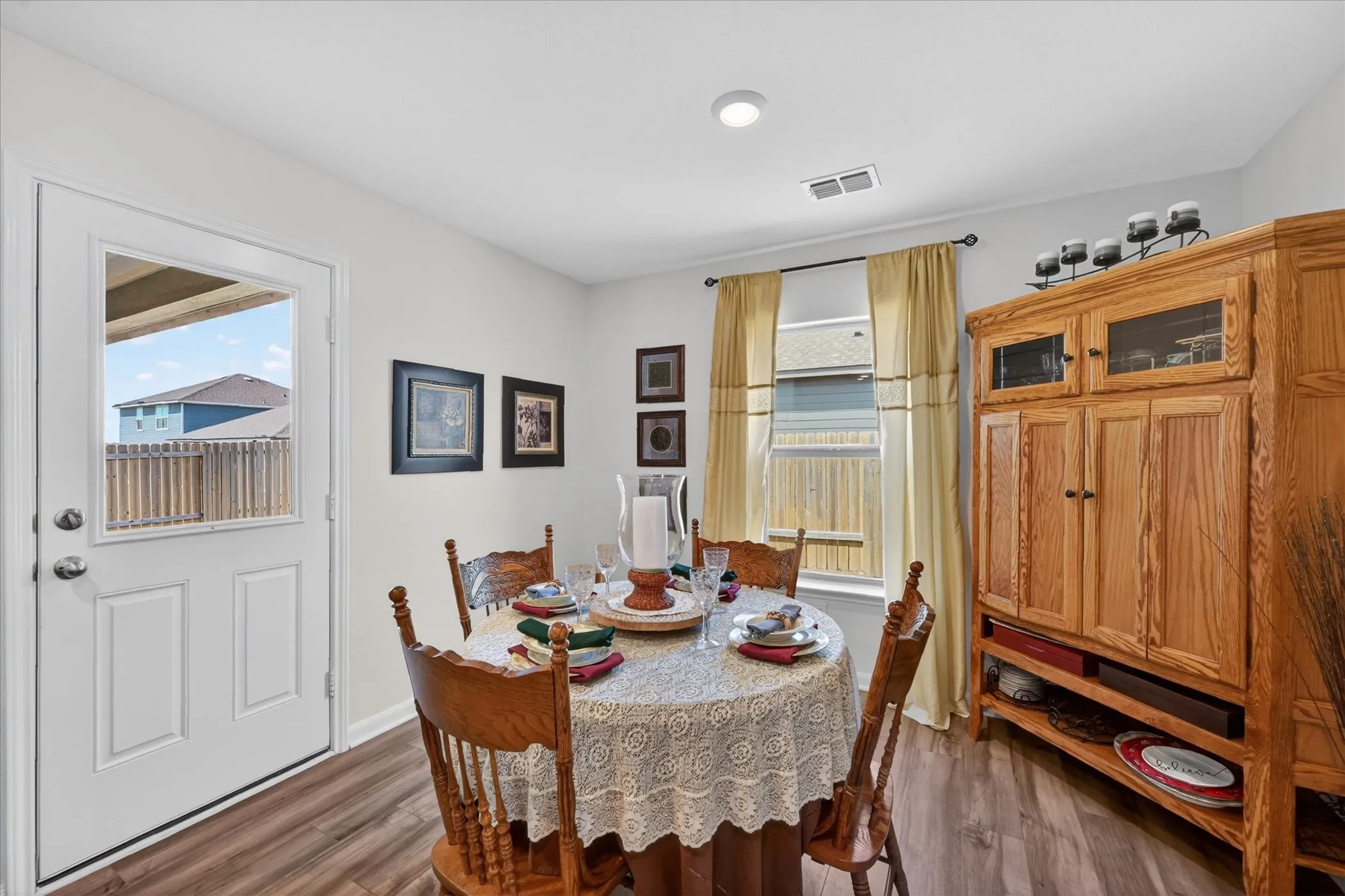 Dining area featuring wood-finish flooring and a window with natural light