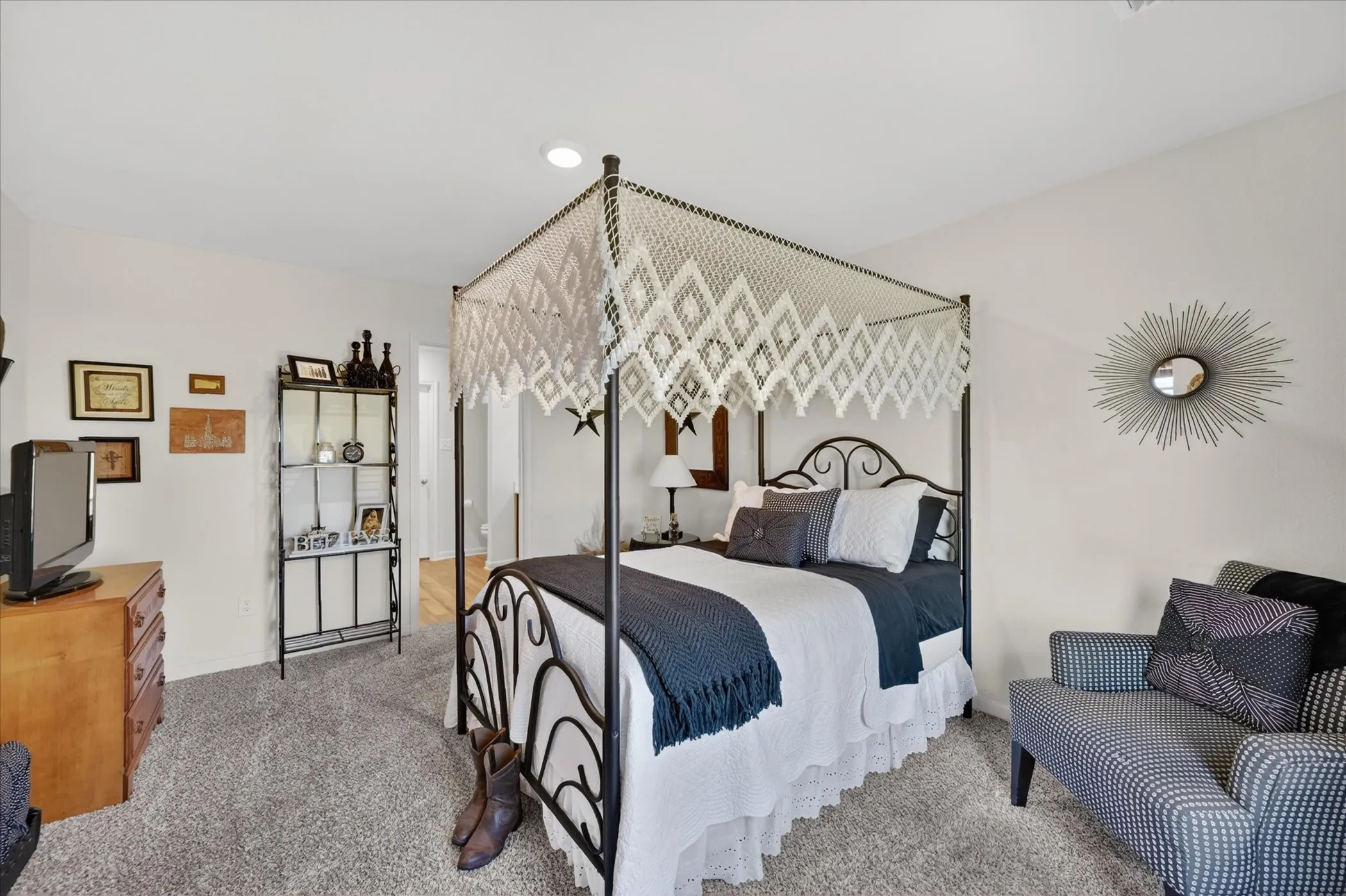 Spacious room with plush carpeting and recessed lighting