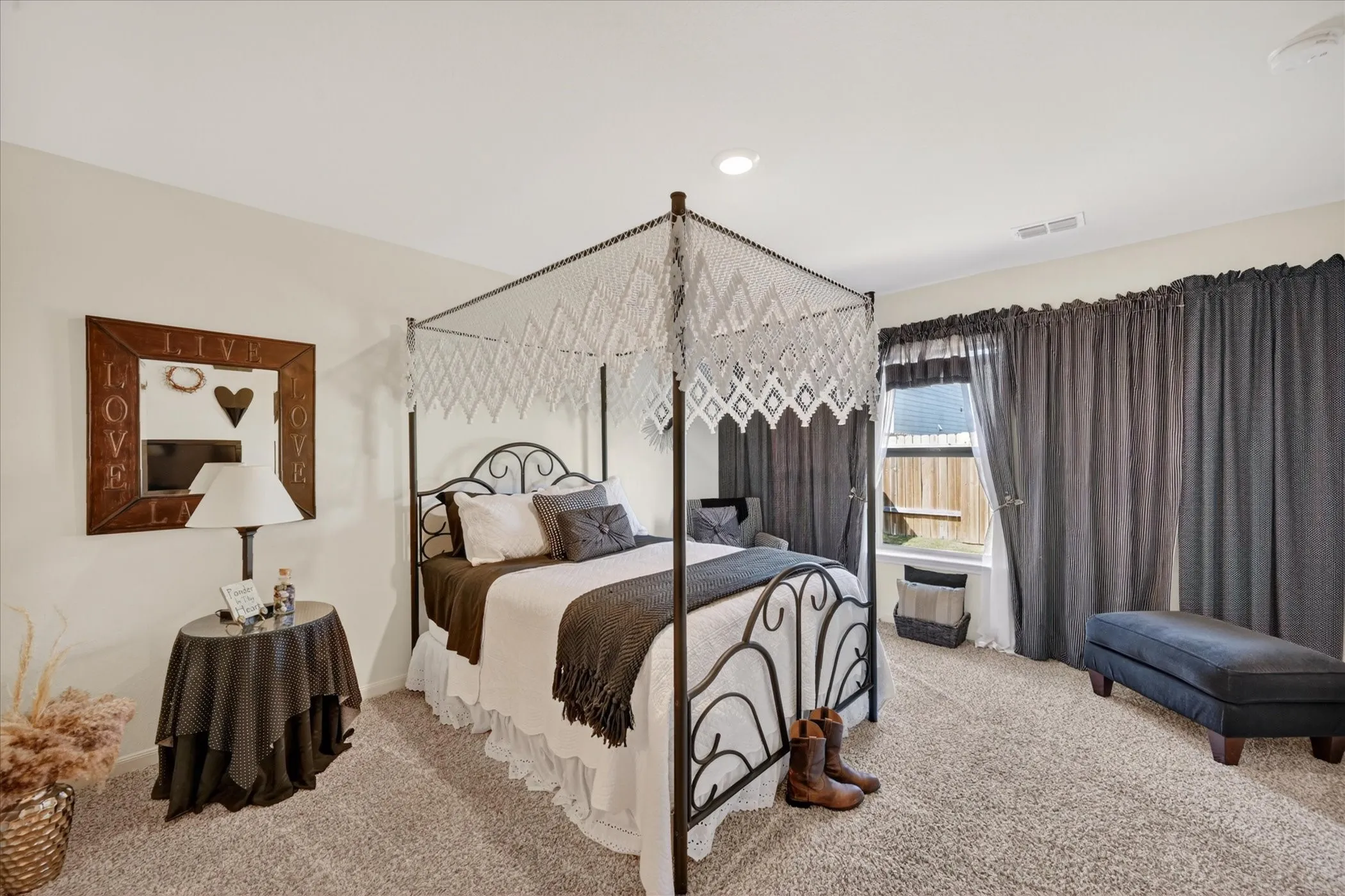 Plush carpeting and light-toned walls create a spacious atmosphere