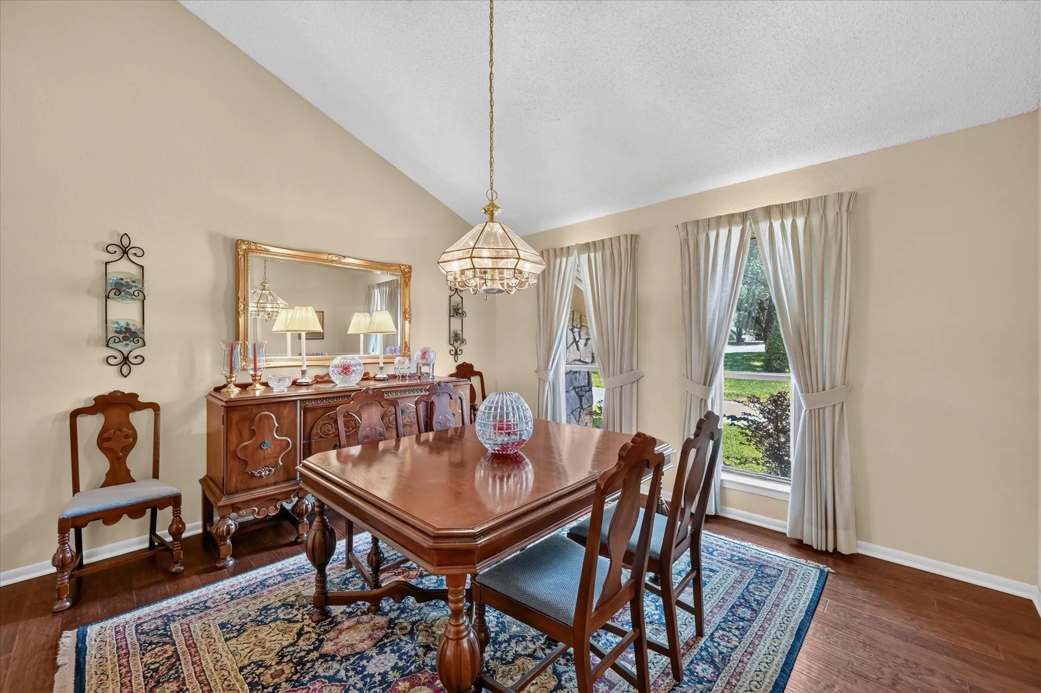Beautiful formal or casual dining area!  Wood floors, light & bright, vaulted ceilings!