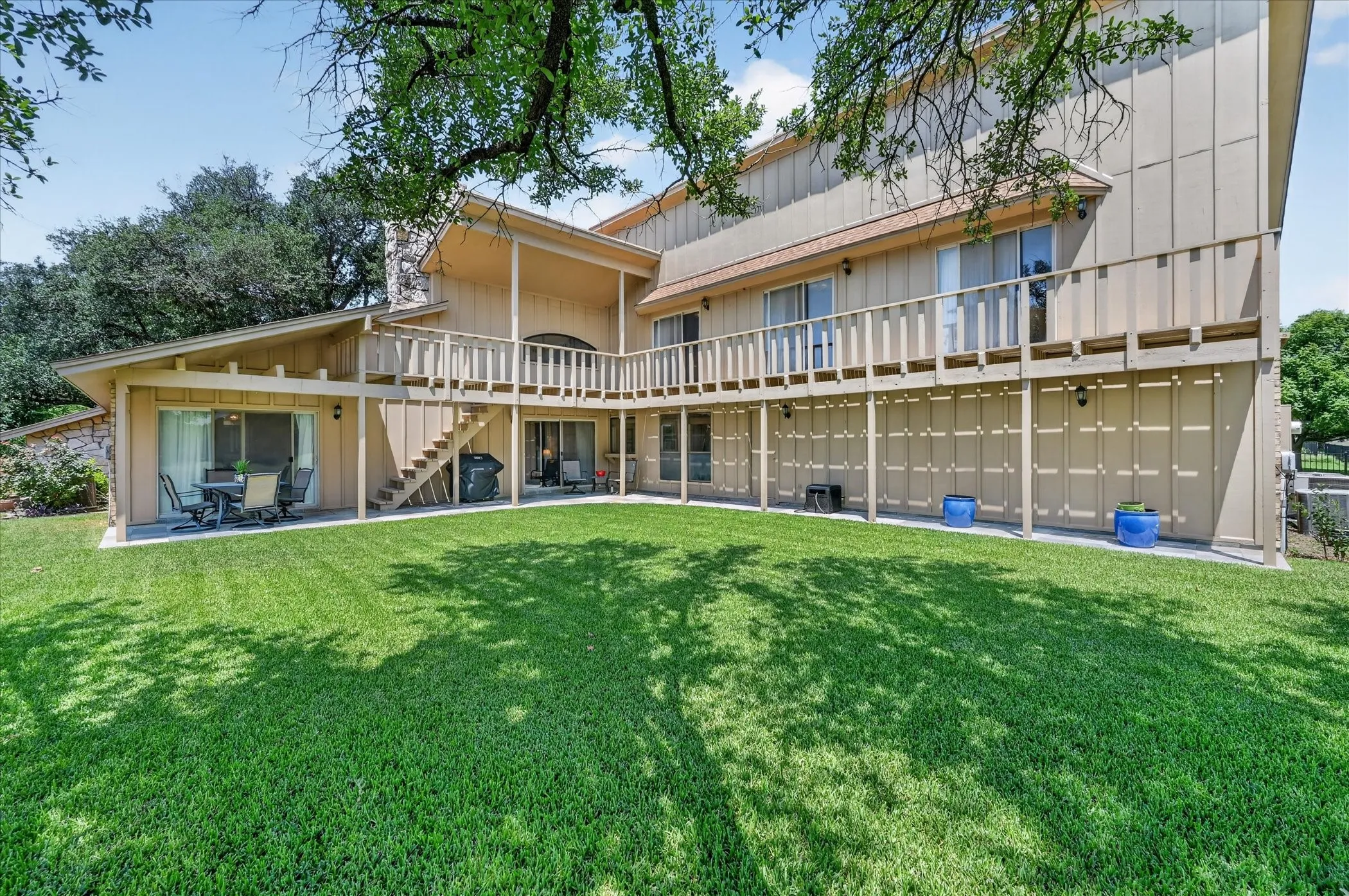 Covered patio, perfect place for a pool, all three bedrooms upstairs have access to the deck!
