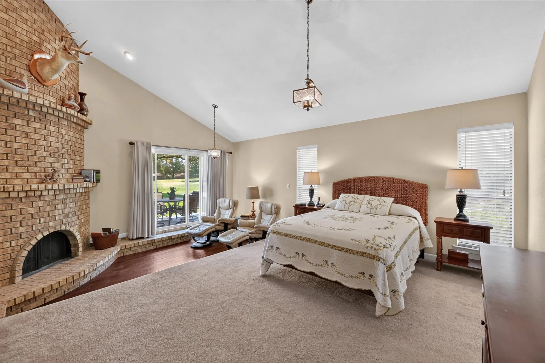 Private primary bedroom with sitting area, woodburning fireplace!  Views to the back yard & Greenbelt!