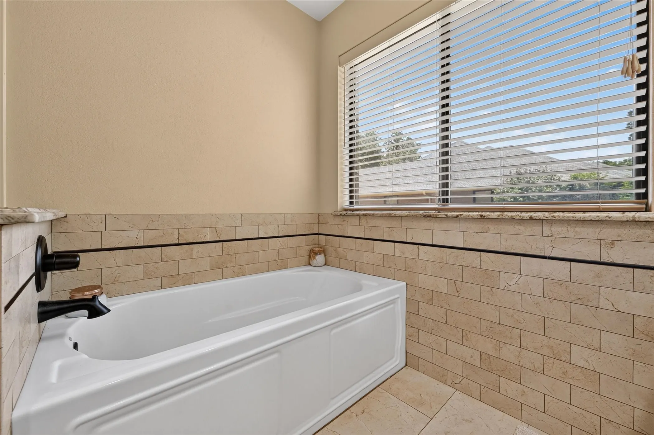 Updated tub and tile surround.  Light & bright!