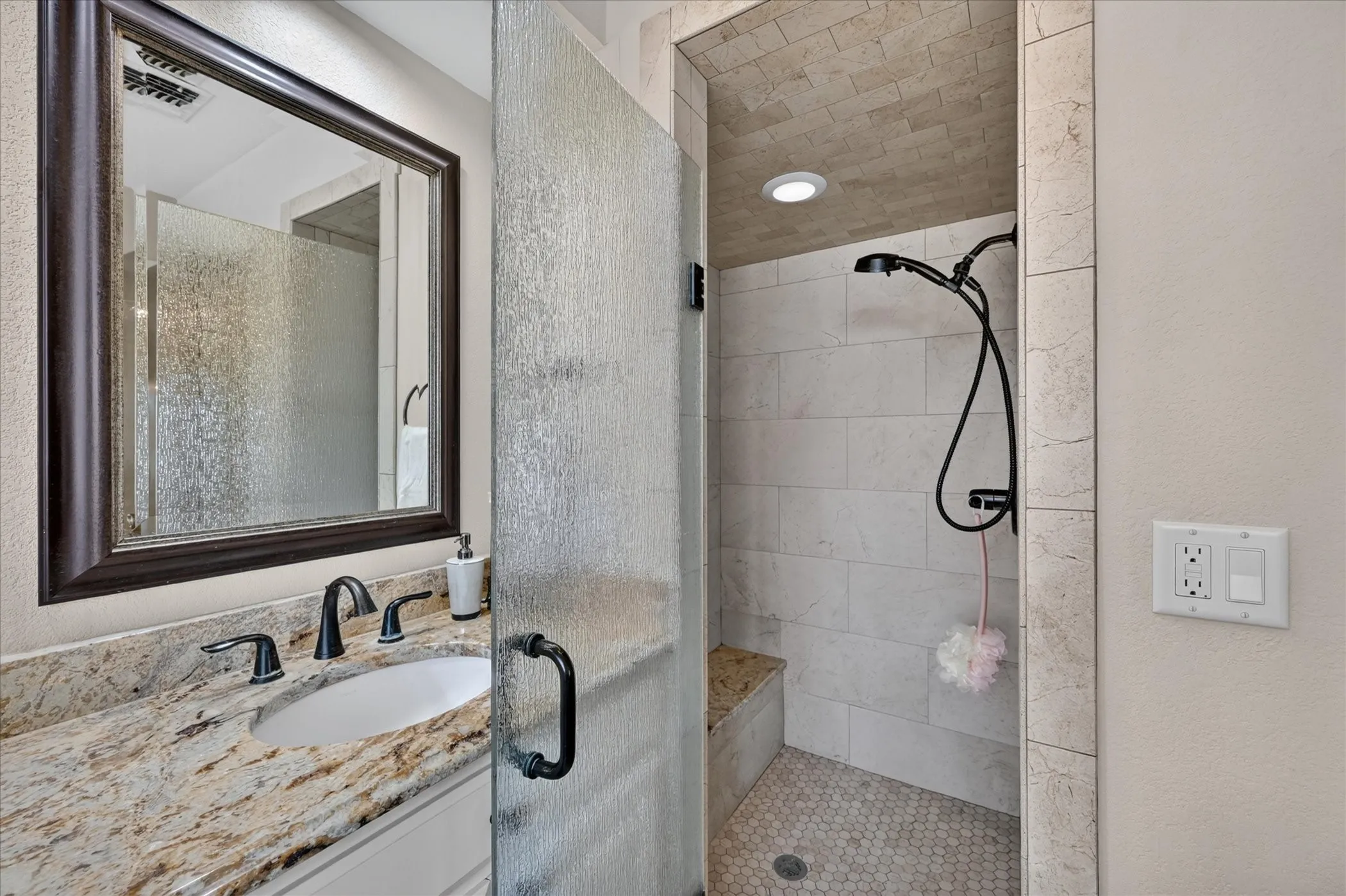 Updated master shower with seat and heavy glass door!