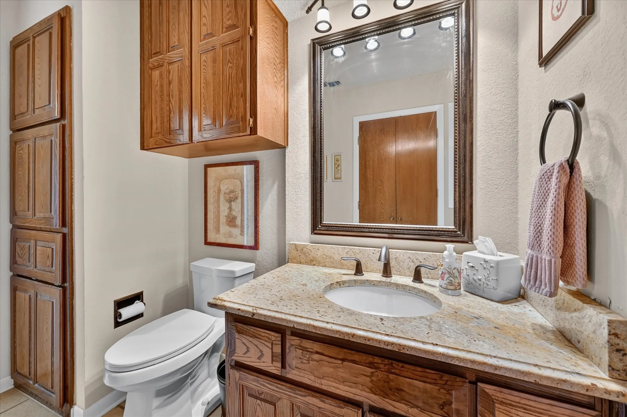 Downstairs half bath.  Access door to the back yard.