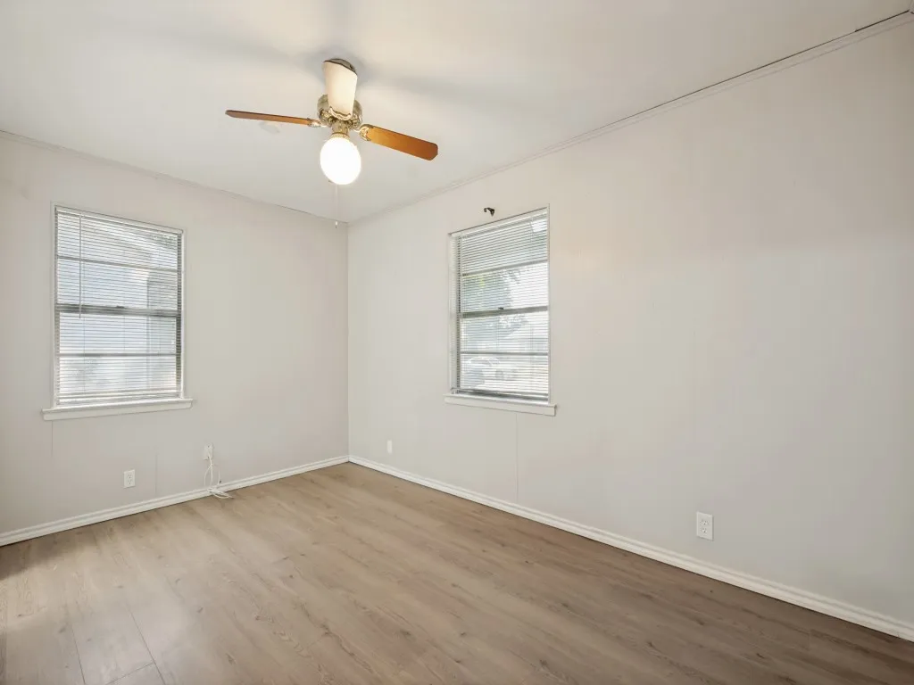 Vinyl plank flooring with white trim, two windows, ceiling fan with light fixture, cedar lined closet and attached​​‌​​​​‌​​‌‌​‌‌​​​‌‌​‌​‌​‌​​​‌​​ bath