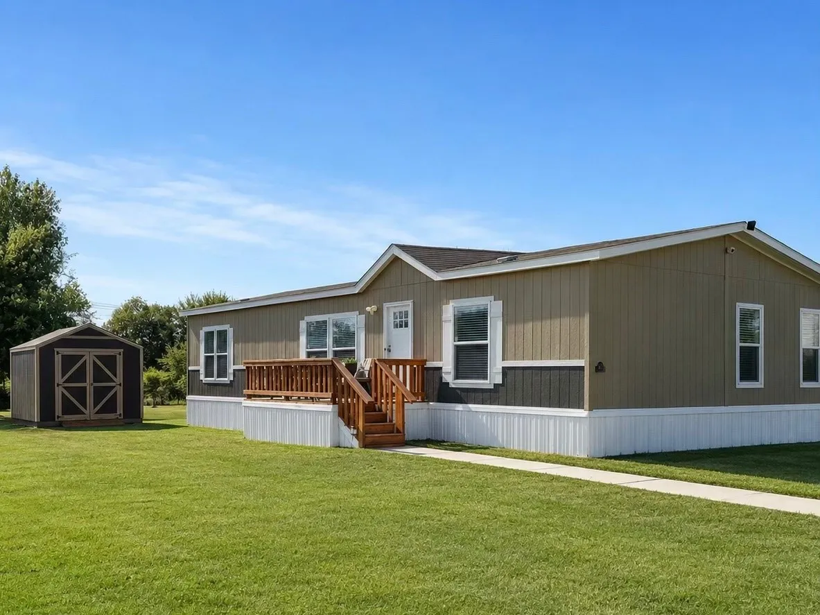Single-story residence featuring a two-tone exterior with vertical siding and white trim