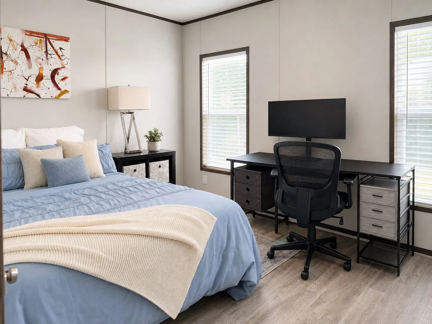 Neutral wall tones complement the wood-finish flooring in this room