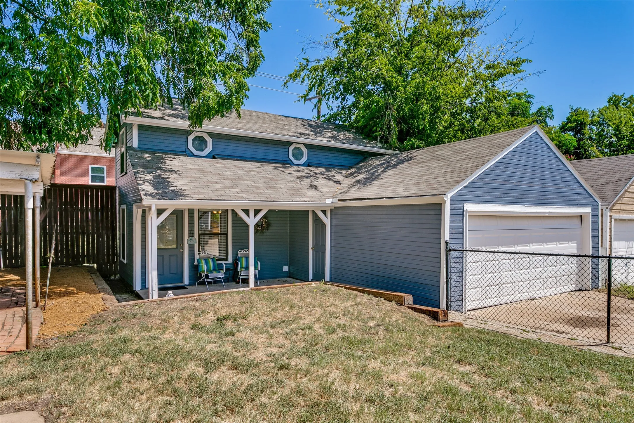 The guest house is too the left of the detached 2 car garage.