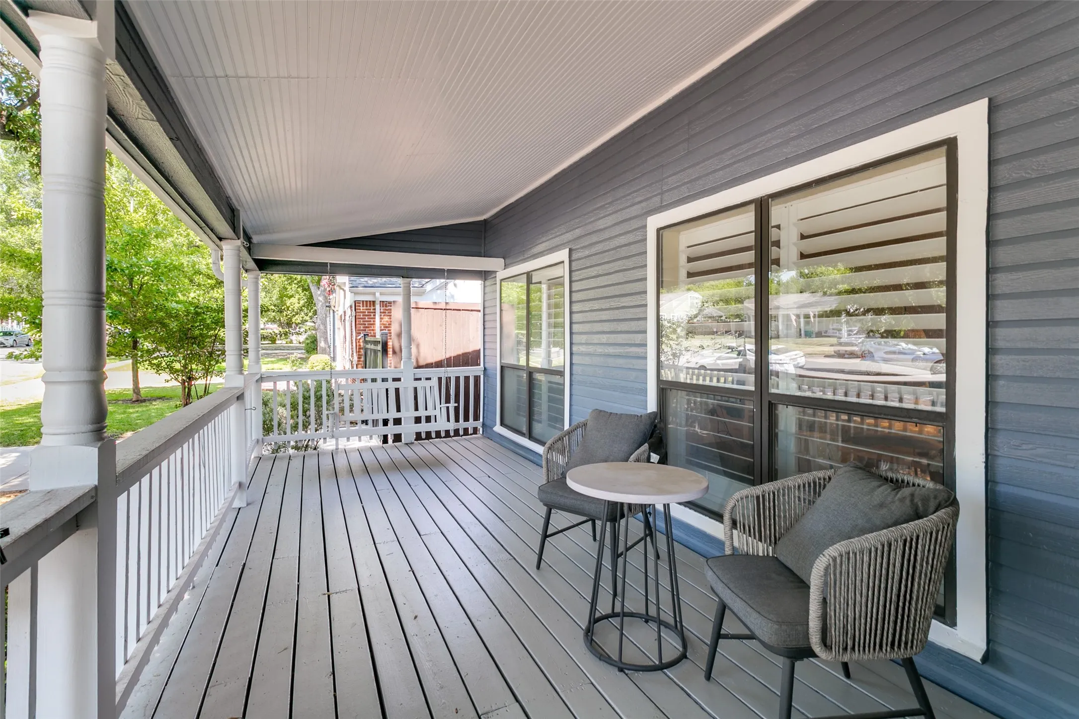 The covered front porch extends the length of the home and is a great place to relax.