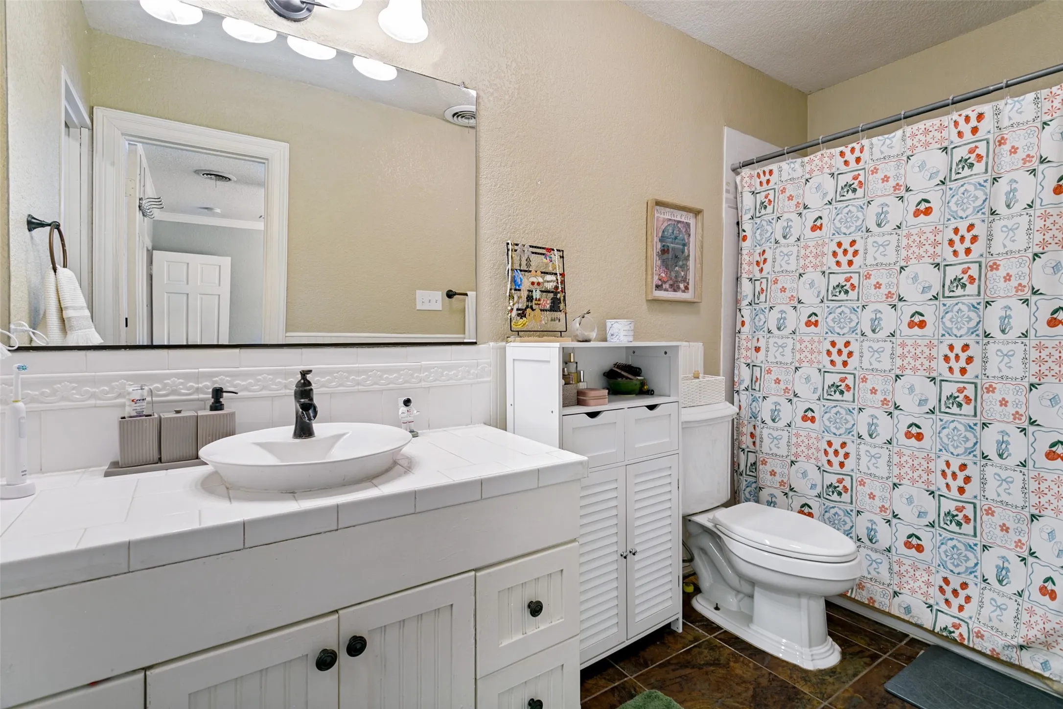 The ensuite primary bathroom has been updated. There is a large walk in closet to the left.