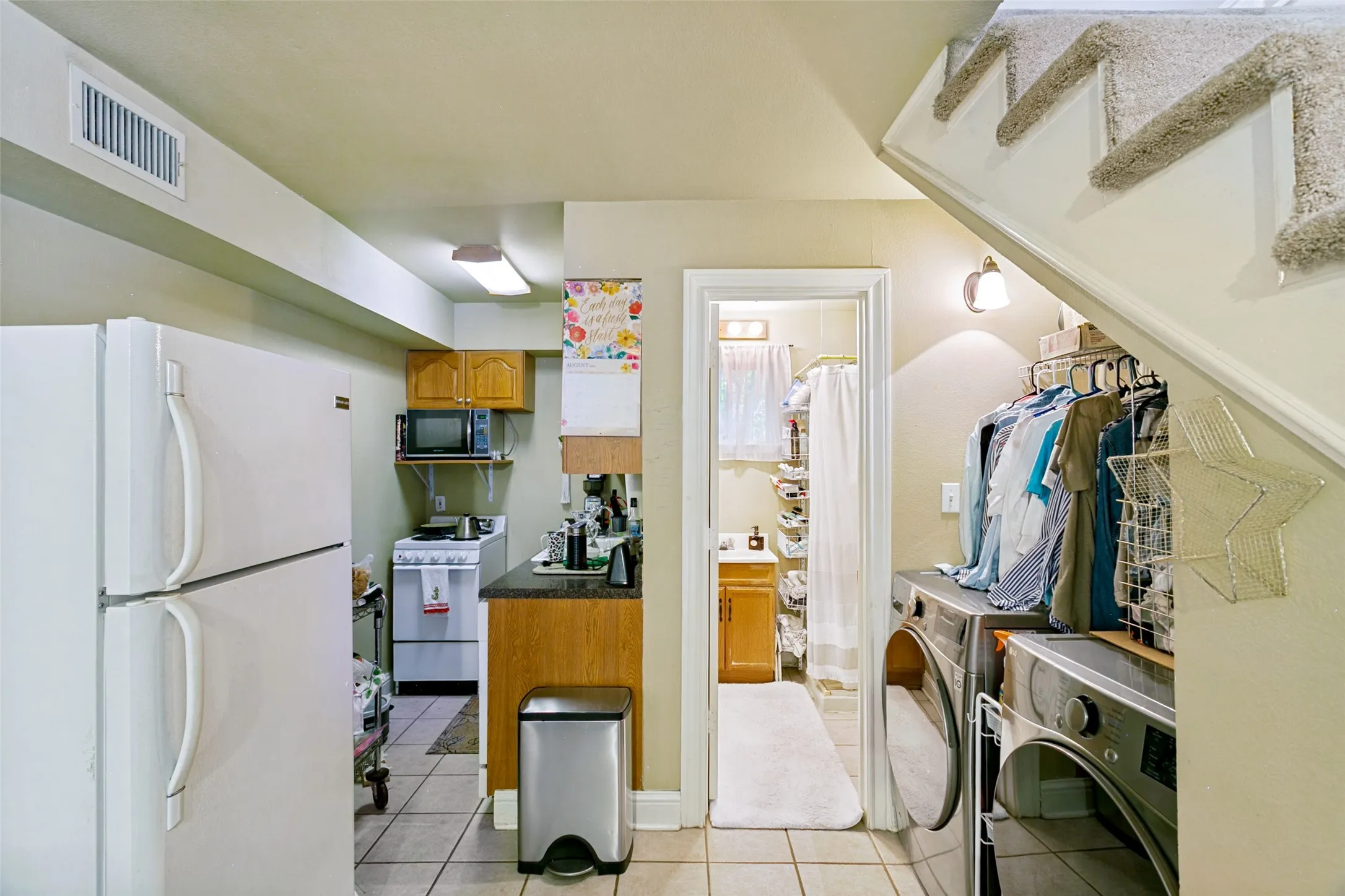 The guest house kitchen, laundry area and bathroom beyond.