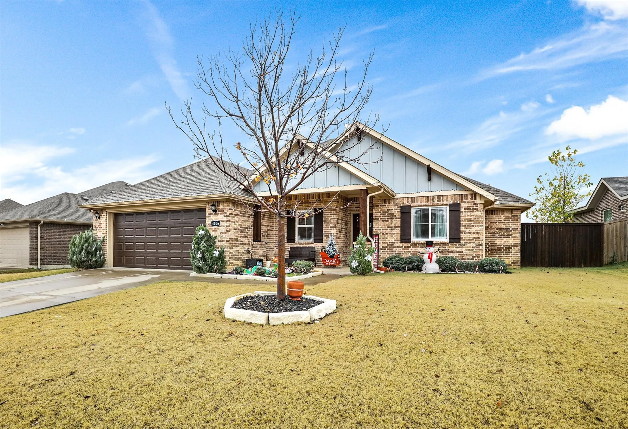 Brick exterior with a gabled roofline and board-and-batten accent