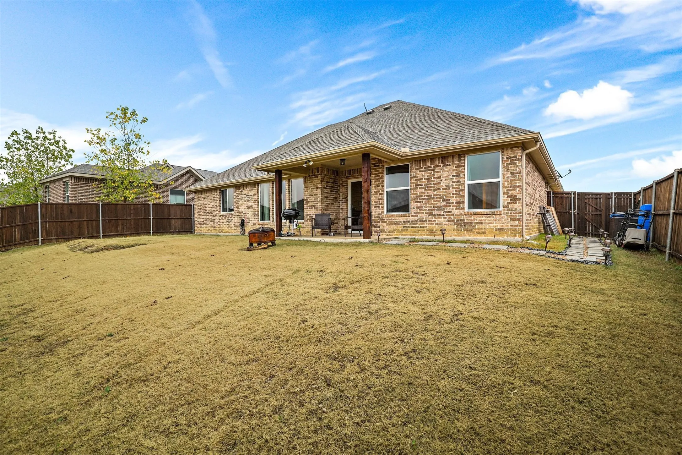 Expansive backyard with a full privacy fence