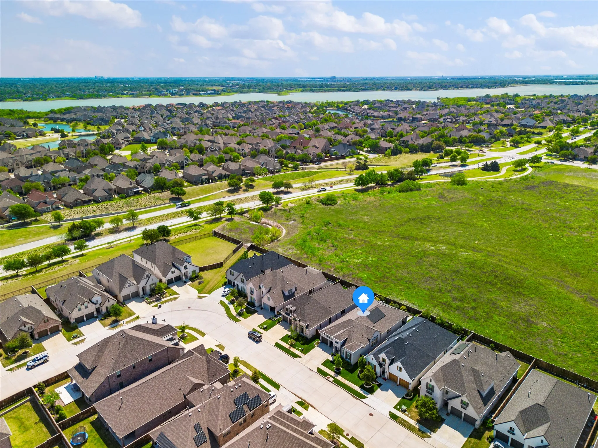 Aerial perspective of suburban area with a nearby body of water