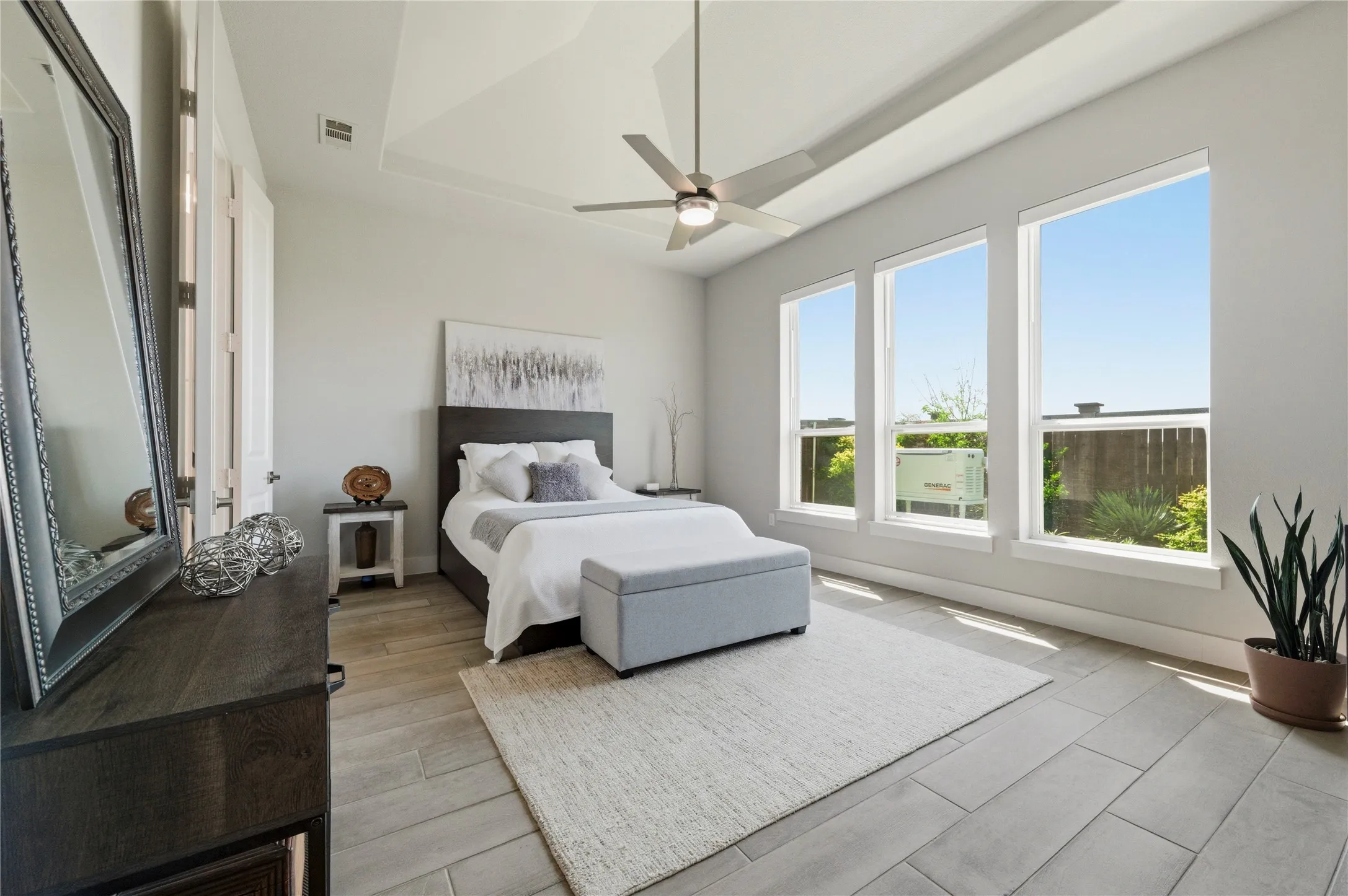 Bedroom featuring a ceiling fan and light wood finished floors
