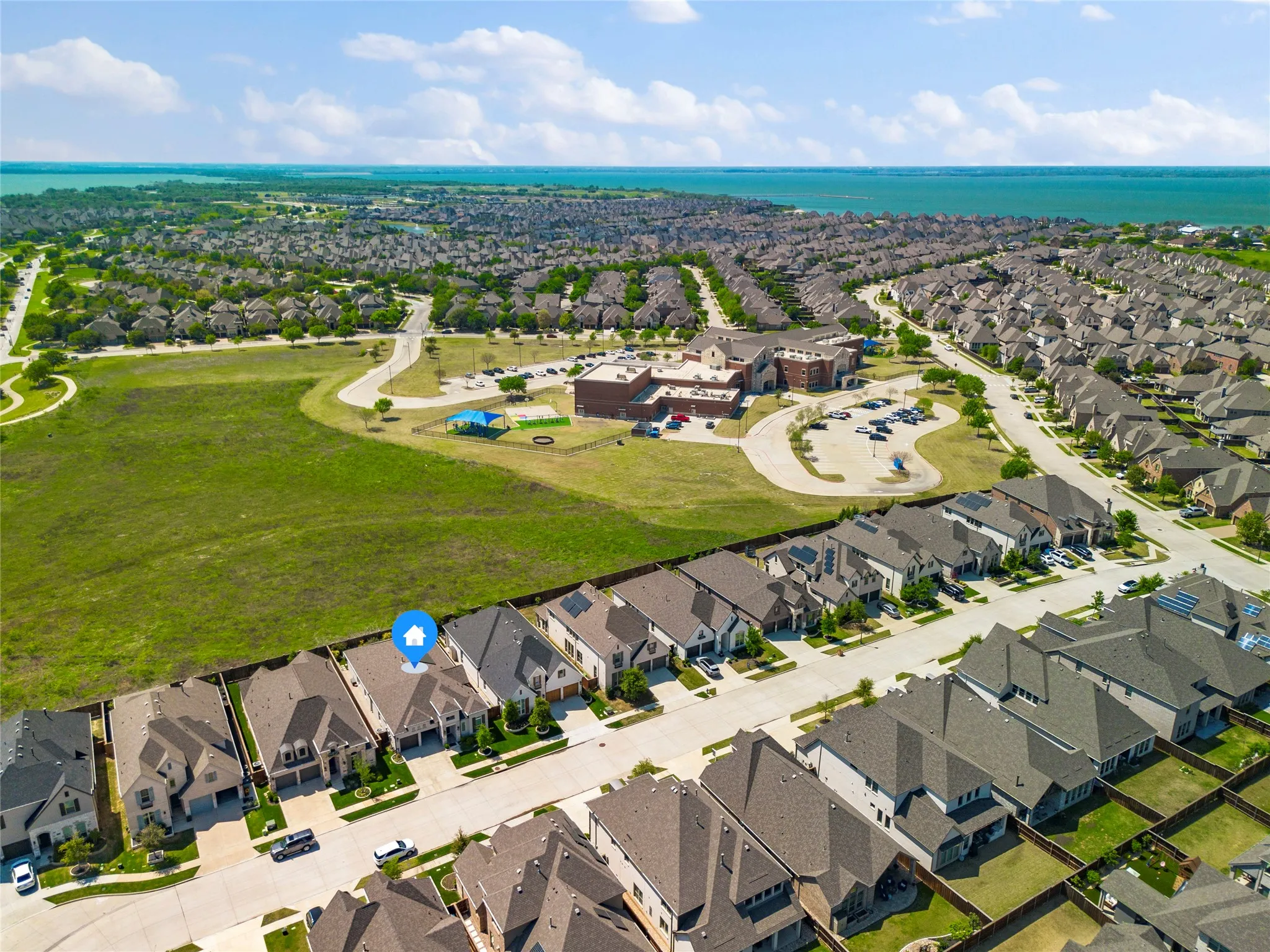 View of property location with nearby suburban area
